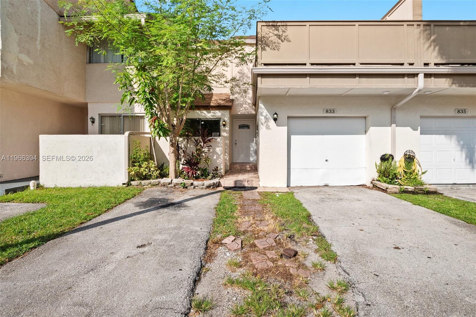 Beautiful and spacious 3-bedroom townhome in the heart of Plantation! This well-maintained home offers generous square footage and an open dining/living area perfect for entertaining. The first floor features tile flooring throughout, while the second floor offers warm wood flooring. A fully fenced, oversized back patio provides the ideal space for outdoor relaxation or gatherings.

The garage has been thoughtfully converted into a 4th bedroom, offering additional flexibility for guests, a home office, or extra living space. The primary bedroom includes a recently updated en-suite bathroom and a large private terrace, creating a peaceful retreat.

Centrally located near major roadways, top-rated schools, and plenty of shopping and dining options. The community offers fantastic amenities including a pool, tennis courts, clubhouse, and playground.

HOA requires a minimum 650 credit score. No leasing permitted during the first year of ownership.