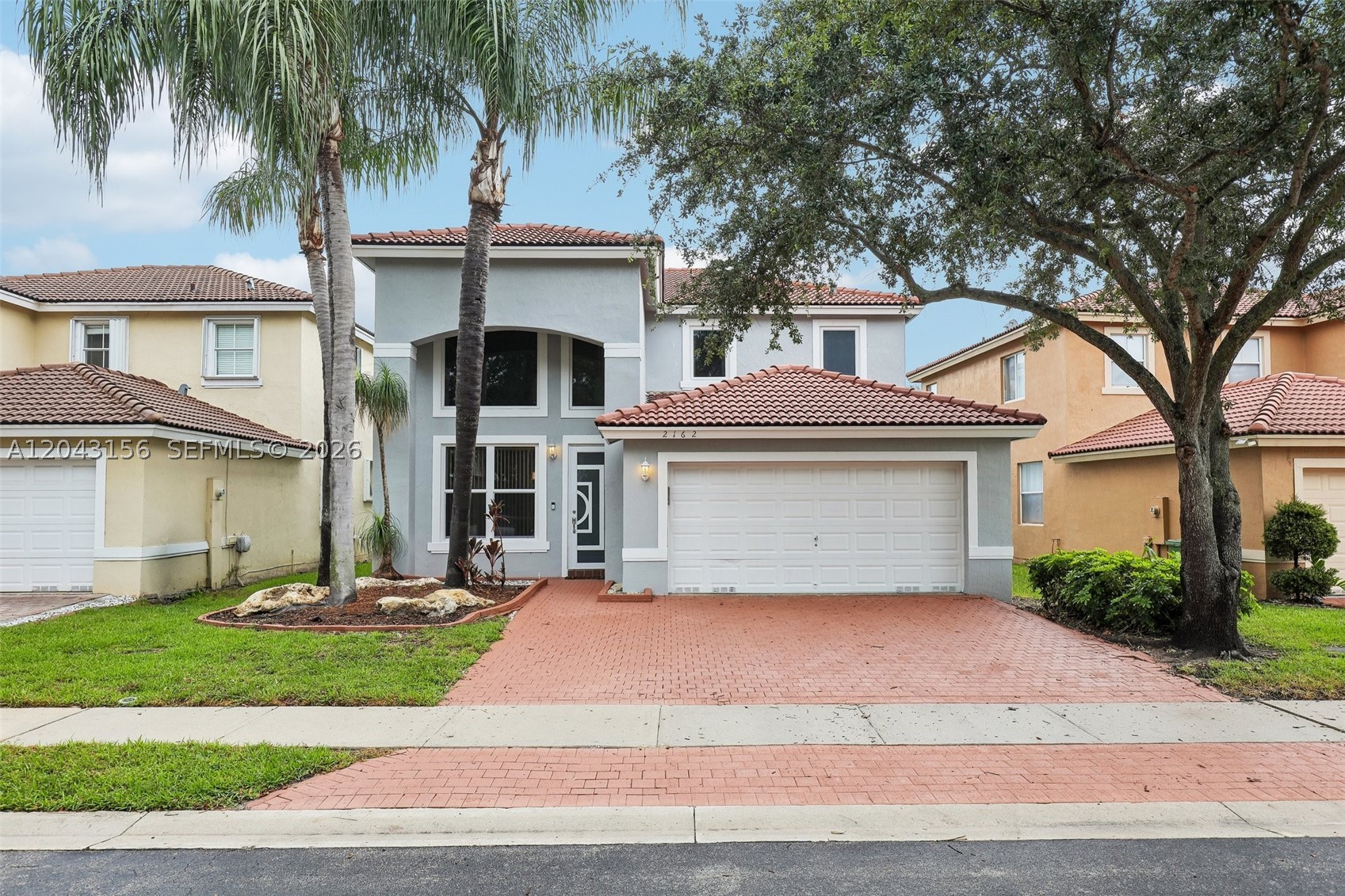 Beautiful waterfront home located in Walnut Creek, a gated community in Pembroke Pines! This spacious 4-bedroom, 3-bath residence offers 2,190 sq ft of living space with a desirable layout including a full bedroom and bathroom on the first floor! Perfect for guests or multigenerational living! The home features vaulted ceilings, abundant natural light, luxury vinyl plank flooring throughout, all impact windows and doors, 2024 new AC system, and a new water heater for added peace of mind! Enjoy a functional floor plan with spacious living areas, excellent condition throughout, and move-in ready appeal! Step outside to a private backyard overlooking a tranquil lake view—perfect for relaxing or entertaining! Additional highlights include a versatile upstairs loft, 2-car garage, and beautiful waterfront views! The gated community offers resort-style amenities including a clubhouse, swimming pool, basketball courts, and tennis courts! This home is a must see!