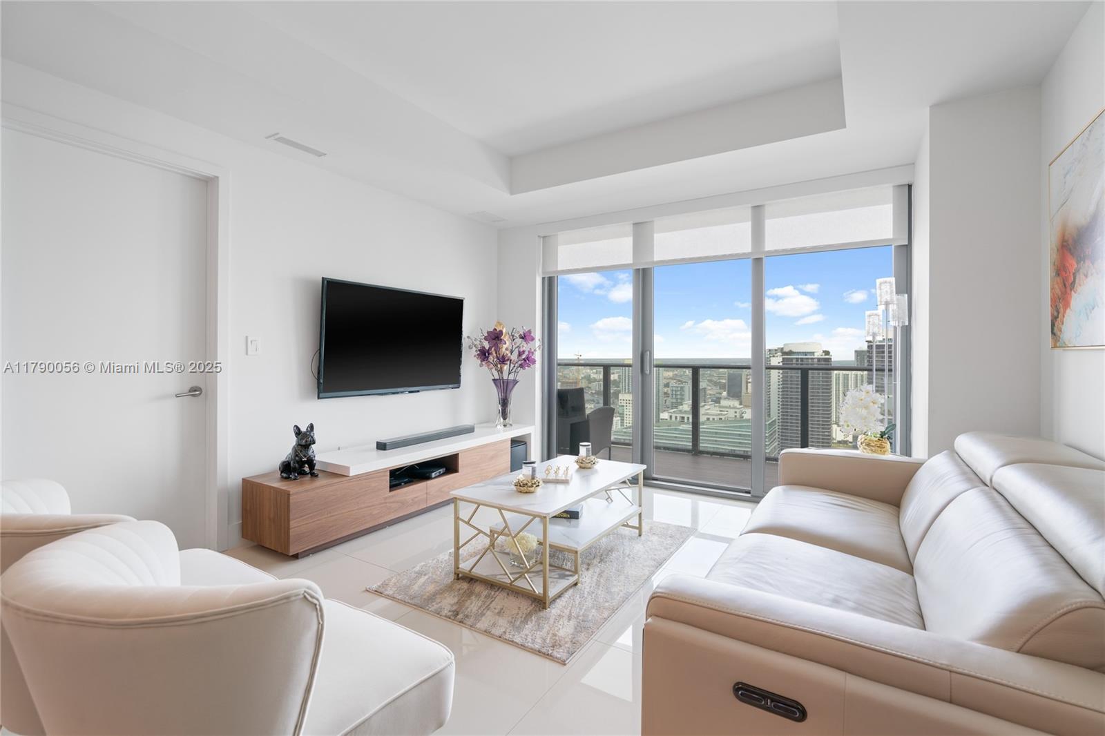 Discover luxury living in Brickell's sought-after DUA Brickell Residences. This beautiful and spacious corner unit boasts 2 beds, 2 baths, plus a den. Enjoy breathtaking water and city views from your wraparound balcony. The European kitchen is fully equipped with top-of-the-line appliances. The tile floors add a touch of elegance and class. Take advantage of the incredible amenities and prime location, just steps from fine restaurants, banks, shops, and more. This is the perfect place to call home!