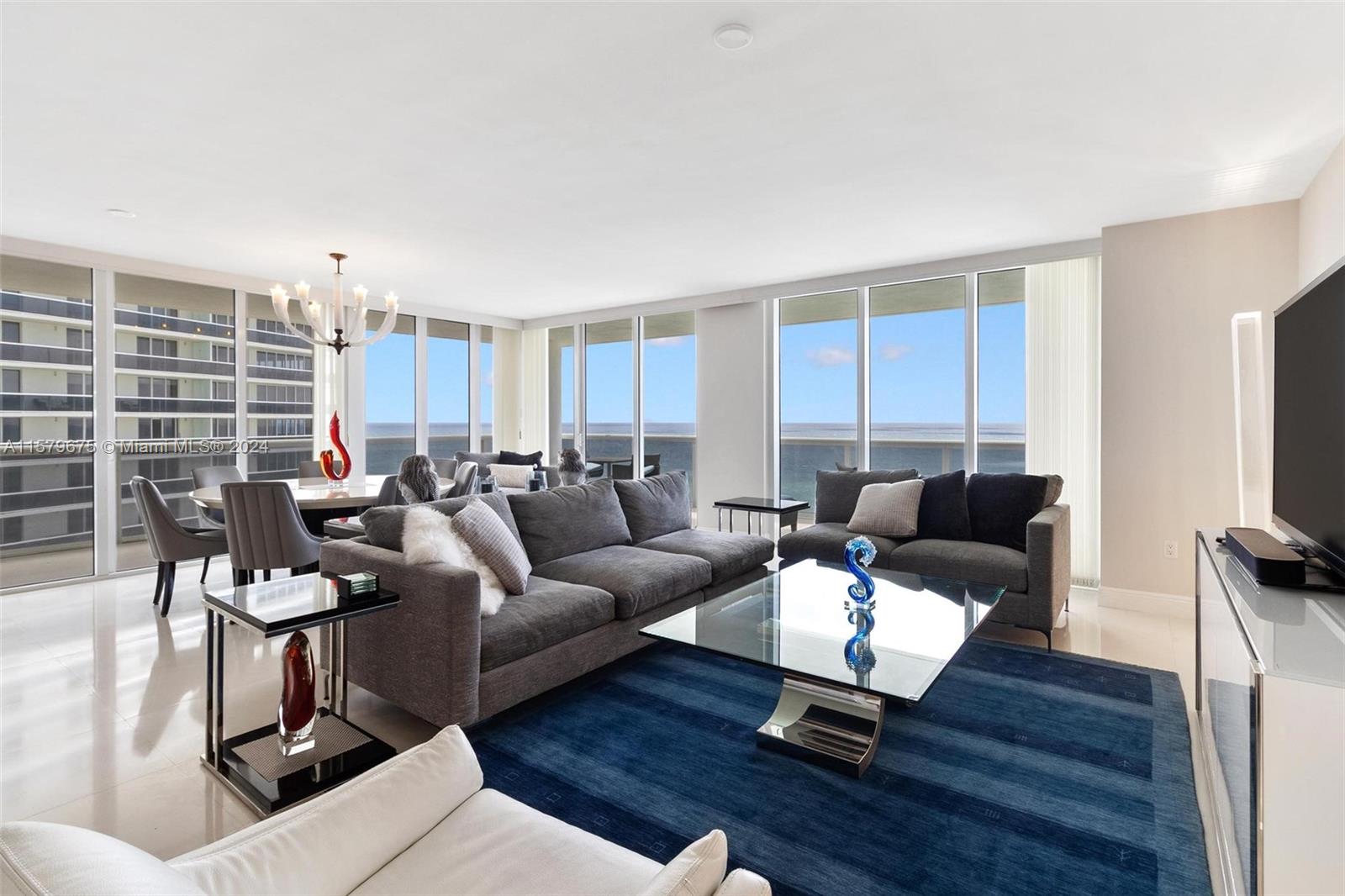 Enjoy stunning direct ocean views from this Northeast corner unit with a big wraparound balcony. This condo offers an open floorplan with an oversized living area and floor to ceiling windows. Beach Club complex has great amenities such us 50,000 sq. ft. spa & fitness center, infinity pools, full bar/restaurant with pool and beach service, 24/7 concierge service, valet parking, and security.