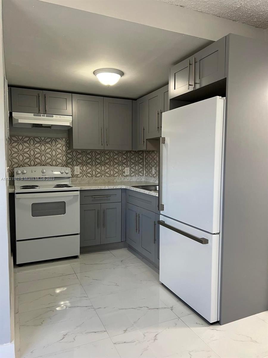 COMPLETELY REMODELED spacious 1 bedroom/1 bathroom unit, BRAND NEW Kitchen (Modern Cabinets), new appliances, beautiful ceramic floor,  NEW BATHROOM, gated community within close proximity to all major highways such at I-95, Florida Turnpike, Palmetto (826) & State Rd.7 (441) Easy access to public transportation and Walmart within walking distance from the complex. Spacious living and dining area and Laundry facilities are on the premises for your convenience. Unit is READY for occupancy.