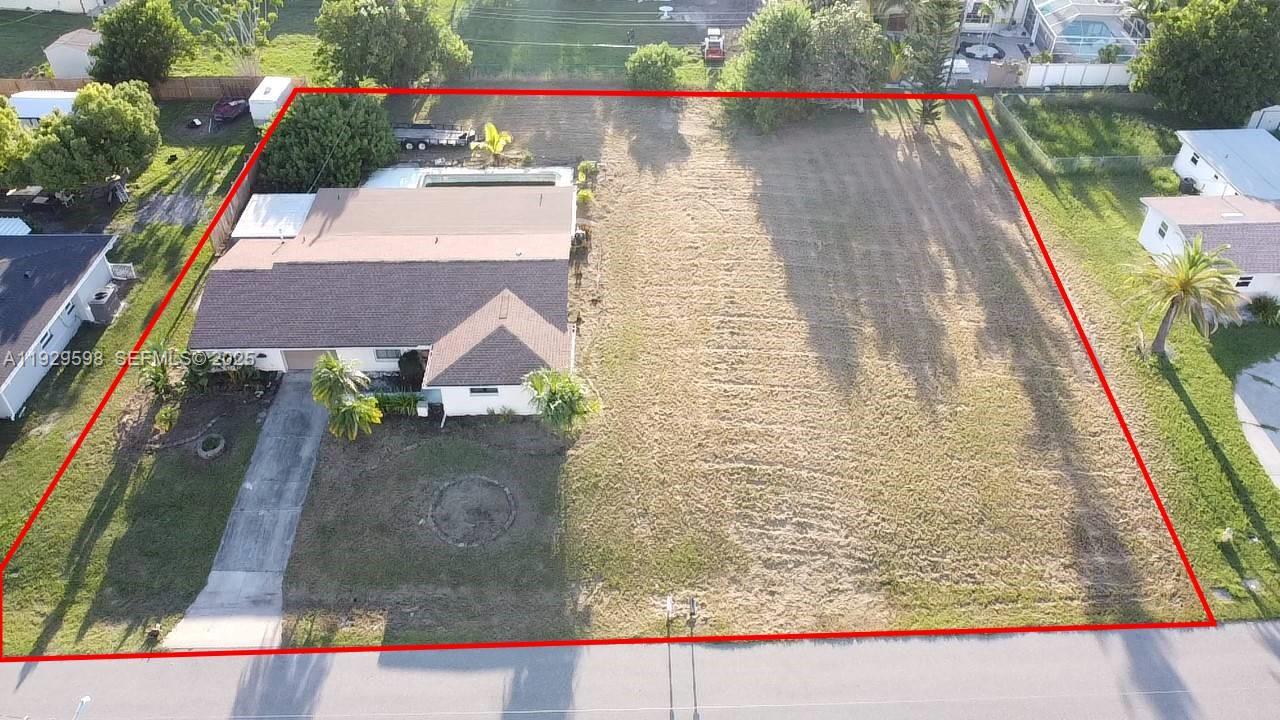 Here is an excellent, handyman-friendly opportunity to acquire a comfortable, layout house on a double lot totaling half an acre. This house features a nice pool, three bedrooms, three full baths, an attached two-car garage with a laundry hook-up, and two screened great Florida rooms. Even though a licensed roofing contractor professionally replaced the entire roof in 2023 (per Charlotte County records), and the house is livable, it will require the buyer's personal taste, upgrades, and TLC to make it the perfect home. Don't miss out on an opportunity to own this beautiful home with a pool on a double lot at the end of a peninsula community with minimal vehicle traffic.