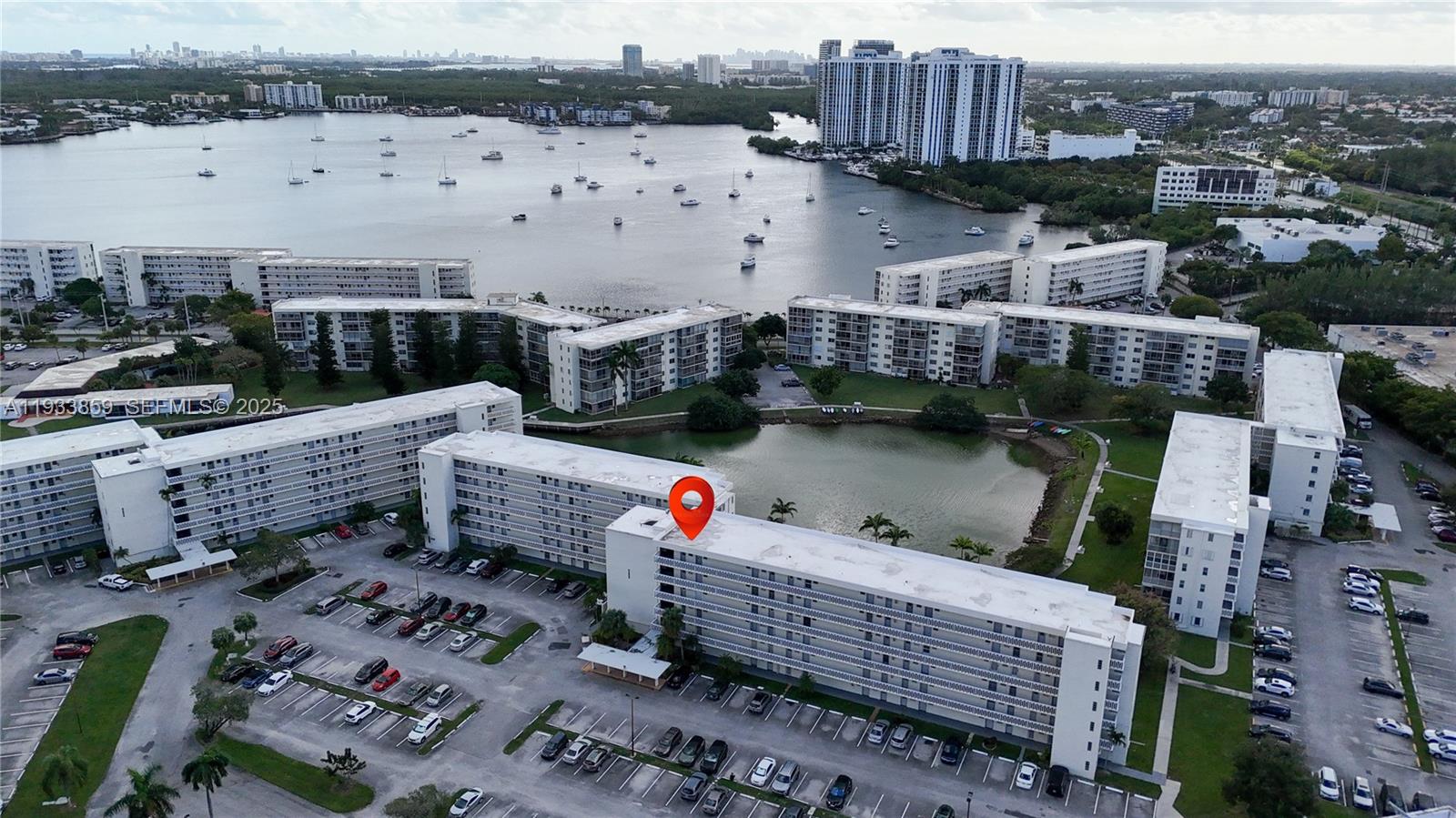 Welcome to this well-maintained 55+ waterfront condo in the heart of Aventura, offering serene views of Maule Lake. Located in a financially sound community with 50-Year Certification Complete and Reserves in Place, this residence provides peace of mind and exceptional value. The condo features a spacious layout with carpeted main living areas, a generously sized bedroom with two walk-in closets, and an accessible master bathroom with a combination tub/shower. Enjoy your mornings or evenings on the screened balcony overlooking Maule Lake. Additional highlights include brand-new elevators, tankless water heater, regularly maintained A/C, three ceiling fans, and a reserved parking space directly in front of the building entrance. The HOA offers an impressive amenity package: clubhouse with card room, billiards, library, bowling, and auditorium; pool; on-site shuttle service to shopping and medical centers; 24-hour security; and water, cable, and internet included. Conveniently located near shopping, dining, and major roadways. A fantastic opportunity for comfortable, active waterfront living in Aventura.