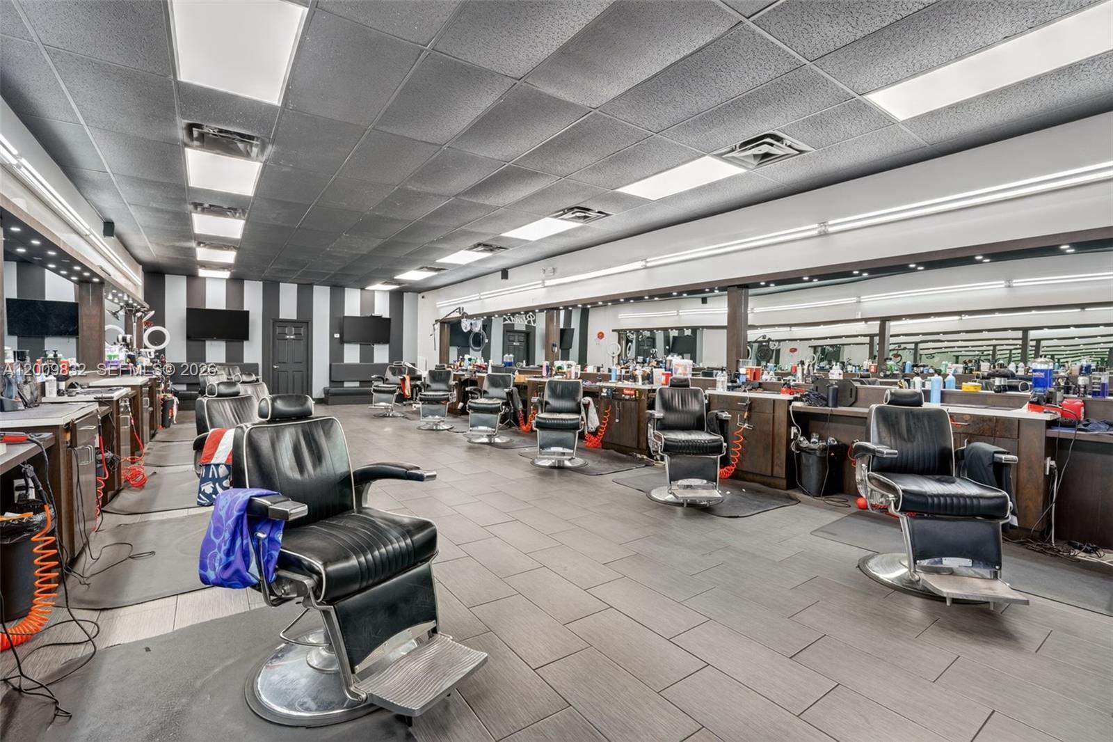 Excellent opportunity to own a well-established barbershop in the highly desirable Kendall area. With 12 years in business, this shop has built a loyal customer base and strong community presence.
The space features 1,300 square feet with 12 fully equipped barber stations, currently staffed by 9 barbers. Each barber pays $250 weekly rent, providing consistent income with room to grow by filling the remaining stations. The shop operates under a month-to-month lease with a current rent of $5,400, offering flexibility for a new owner. This is a turnkey operation—ideal for an owner-operator or investor looking to step into a profitable, established business with immediate cash flow. CALL US ANYTIME, WE PICK UP!!