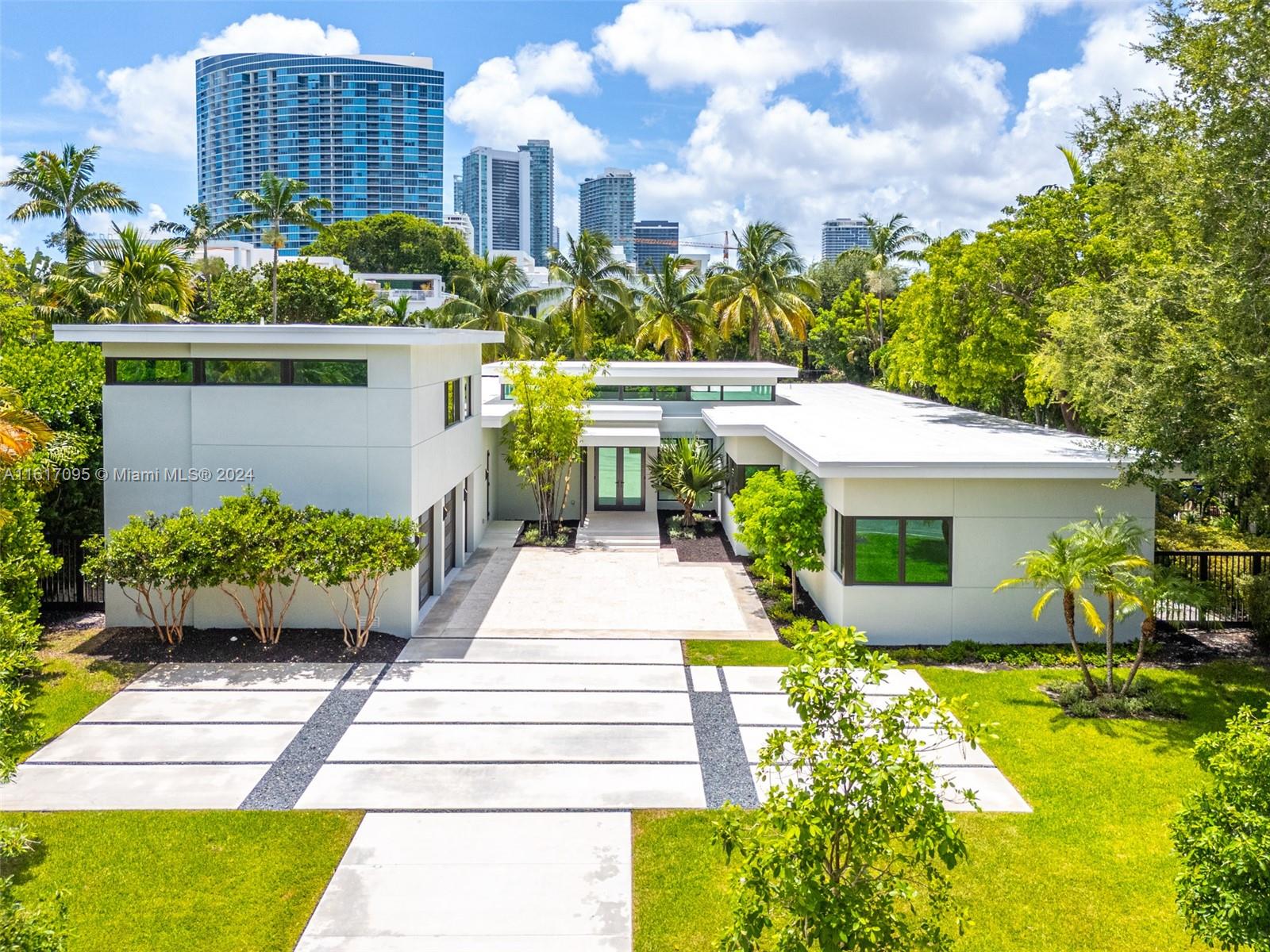 Be the first to live in this stunning new construction home in prestigious Bay Point. Graciously configured, it features a living room with double-height ceilings, a family room, a den, and an office. With seven bedrooms, seven bathrooms, and two powder rooms, this home exudes luxury at its finest. With an abundance of natural light and an incredible floor plan, this home offers a modern tropical lifestyle. Step through the courtyard, and a spacious backyard oasis awaits. Additional features include a resort style pool, an outdoor covered summer kitchen, a two-car garage, a dedicated staff room, a laundry room, and a spacious pantry. Bay Point is a highly coveted private guard-gated community located minutes from the Miami Design District and numerous top-rated private schools.