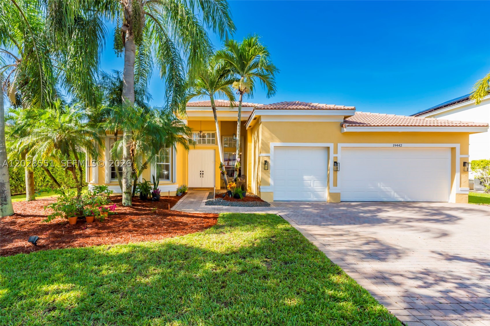 Experience resort-style living in the prestigious Isles at Sunset Lakes. This beautifully maintained 5-bedroom, 3-bath residence offers a desirable split-bedroom floor plan with a spacious single-story layout designed for both comfort and functionality. As you enter, you're welcomed by soaring ceilings and abundant natural light that fills the formal living and dining areas. The chef-inspired kitchen features a large center island, double ovens, ample cabinetry, and overlooks the expansive family room, creating the perfect space for gathering and entertaining. The private primary suite is a true retreat, complete with dual bathrooms connected by a unique pass-through shower, generous walk-in closets, and views of the tropical backyard. Spacious secondary bedrooms are thoughtfully positioned for added privacy. Step outside to your own private oasis featuring a covered patio, lush landscaping, and sparkling pool, ideal for year-round South Florida living. Additional highlights include a brand-new A/C installed in May 2026. Located within a guard-gated community offering resort-style amenities including a clubhouse, fitness center, playgrounds, basketball courts, and more. Exceptional comfort, privacy, and lifestyle await.