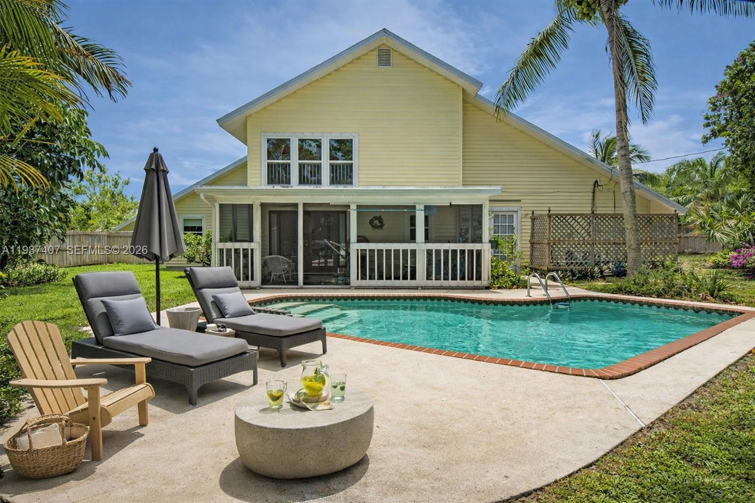No HOA!
Less than 1 mile to boat ramp and 7 mins to the beach, and about 1 mile to both Jimmy Graham Park and Peck Lake Park, this cheerful pool home offers a colorful, activity-filled Florida lifestyle with versatile outdoor space for families. The large fenced backyard features a sparkling in-ground pool, a screened back porch for breezy relaxation, and a fun play set, creating a dynamic space for kids, gatherings, and everyday outdoor living.

Inside, the bright open living area boasts vaulted ceilings and great natural light. Upstairs, the spacious primary bedroom with loft access even offers views of Space Coast rocket launches on clear launch days, a truly special experience. Two additional bedrooms and a shared bath with Jacuzzi tub are located on the main level. A mango tree in the yard and ample parking add to the home’s charm and convenience.

Recent updates include: roof (2019), pool pump (2019), AC (2015), whole-house tenting with warranty (Dec 2022), pool resurfacing (2024), fence updates (2024), and new washer & dryer (2025).