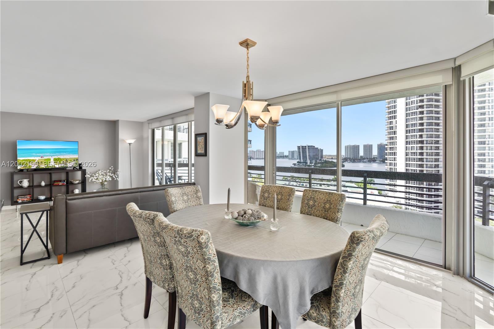 Experience luxury waterfront living in this corner unit condo with Intracoastal views, ideally located in the heart of Aventura just minutes from Aventura Mall, Sunny Isles Beach, and top dining destinations. This bright and spacious residence features a wraparound balcony and abundant natural light, offering the perfect combination of lifestyle, location, and value. Beautifully updated, this Aventura waterfront condo for sale showcases porcelain tile flooring throughout, an open-concept kitchen and premium brand stainless steel appliances, beverage cooler, and an expansive granite countertop that offers ample space and a seamless transition into the dining area—ideal for both everyday living and entertaining. Smooth ceilings, updated lighting, and expansive windows enhance the airy feel of the home, while electric shades provide comfort and privacy. The primary suite serves as a private retreat with dual vanities, a soaking tub, and a fully remodeled shower. The spacious second bedroom features a wall-to-wall closet and marina views. Residents enjoy a full suite of resort-style amenities, including a state-of-the-art fitness center, pool, tennis and pickleball courts, lush gardens, on-site restaurant and café, optional marina, fenced dog park, and electric vehicle stations. Ideally located near beaches, shopping, houses of worship, and top schools. This move-in ready condo with Intracoastal views offers exceptional value & Seller is willing to pay the special assessment.