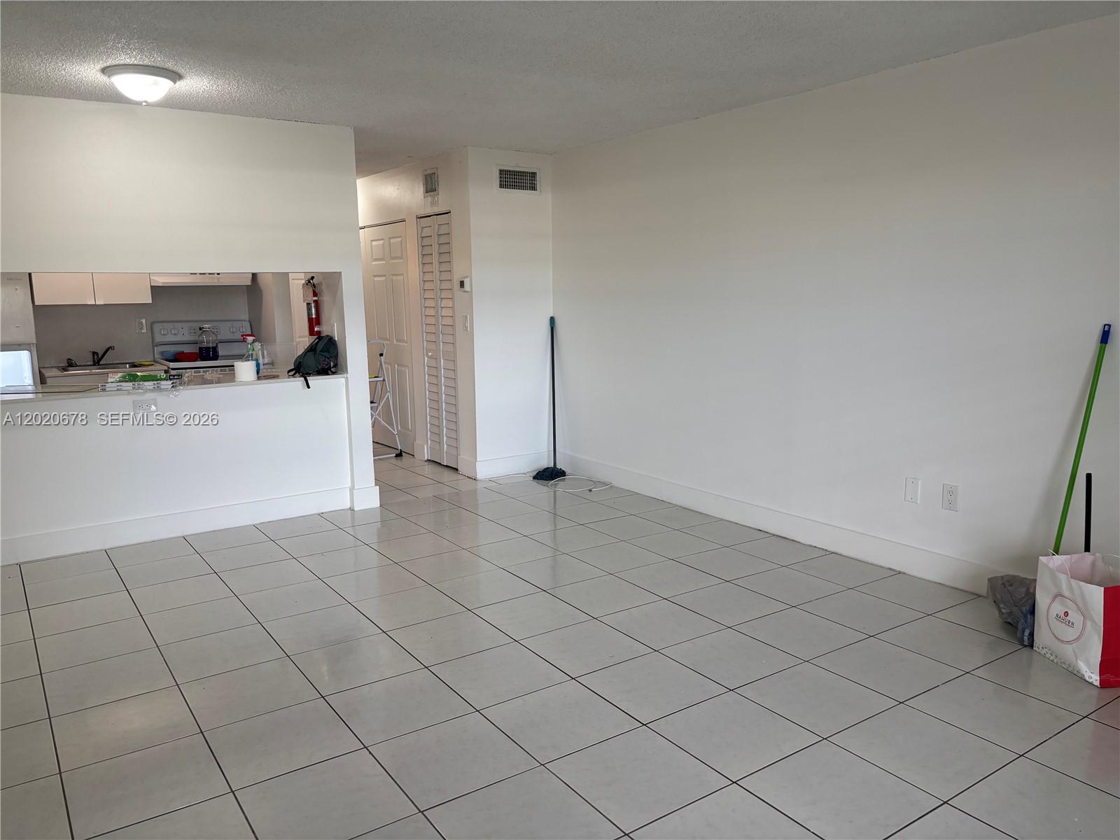 Excellent opportunity for investors or end-users! This cozy 440 sq. ft. studio apartment is conveniently located on the first floor of the New World Condo community in Miami Gardens. Features a newer A/C unit installed just two years ago, tile flooring throughout, an equipped kitchen, and 1 assigned parking space. Unbeatable location situated directly across the street from Walmart Supercenter and just minutes from the Golden Glades Interchange, I-95, Florida's Turnpike, and Palmetto Expressway. Great investor-friendly property with the ability to rent immediately and no special assessments.