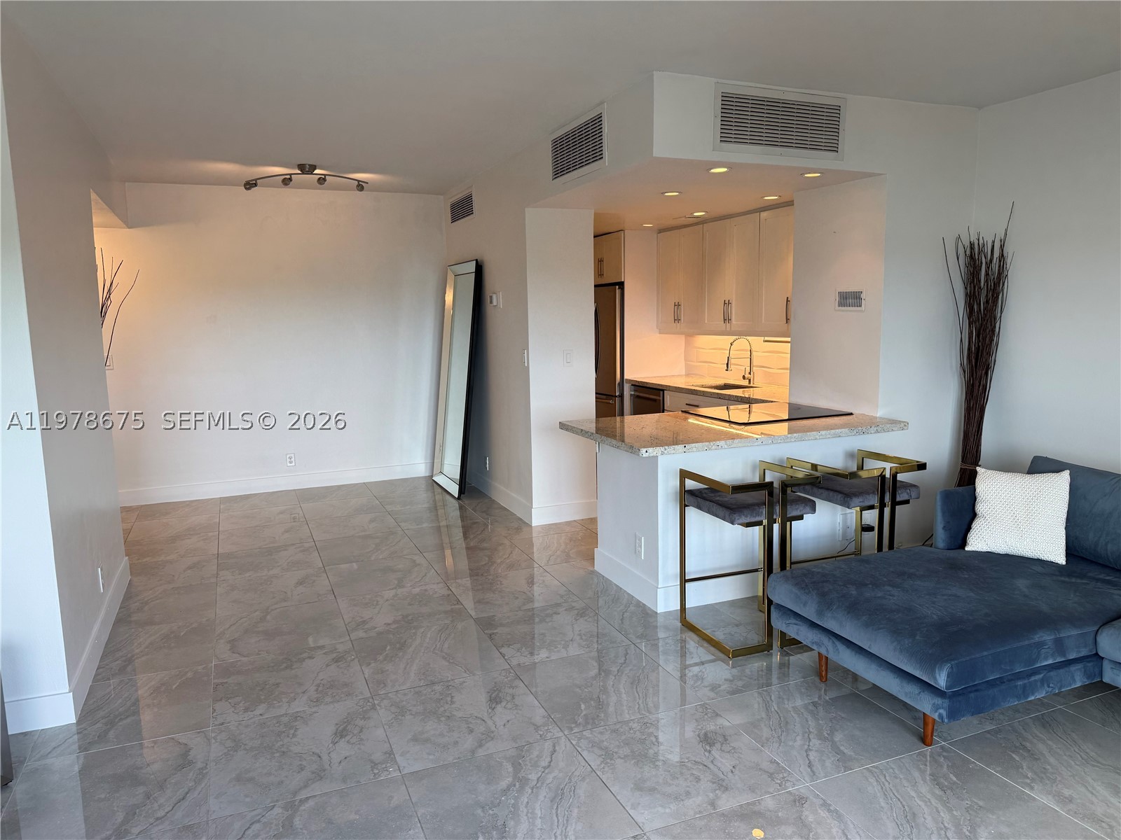Excellent opportunity! Back on the market after 52 days (Buyer failed to secure financing). Turnkey waterfront condo in the thriving MiMo District and one of the most underrated ares of Miami. Located on the bay-facing side of the building, this spacious 1 bed/1 bath offers calming unobstructed million-dollar water views from the living room, bedroom and balcony. Bright and freshly painted, this unit features an open-concept kitchen and entrance, new modern flooring, motorized blinds in the living area, blackout shades in the bedroom, two California-style closets and hurricane-impact windows. New refrigerator and dishwasher appliances recently installed. Resort-style amenities include a large waterfront Pool, 2 Saunas, Tennis court, Rec room, 24/7 Security and 1 designated parking spot. The A/C is included in the monthly maintenance fee (low FPL bill). Recently remodeled lobby, saunas, and updated pool deck. The entire property is gated and secured 24/7. Enjoy a peaceful, residential feel while being steps away from a local waterfront park enclosed in a quiet community and the best of the Upper East Side. Nice neighborhood with fantastic restaurants and weekly farmer's market nearby. To all foreign and out-of-state investors, this is the fastest growing area in Miami.