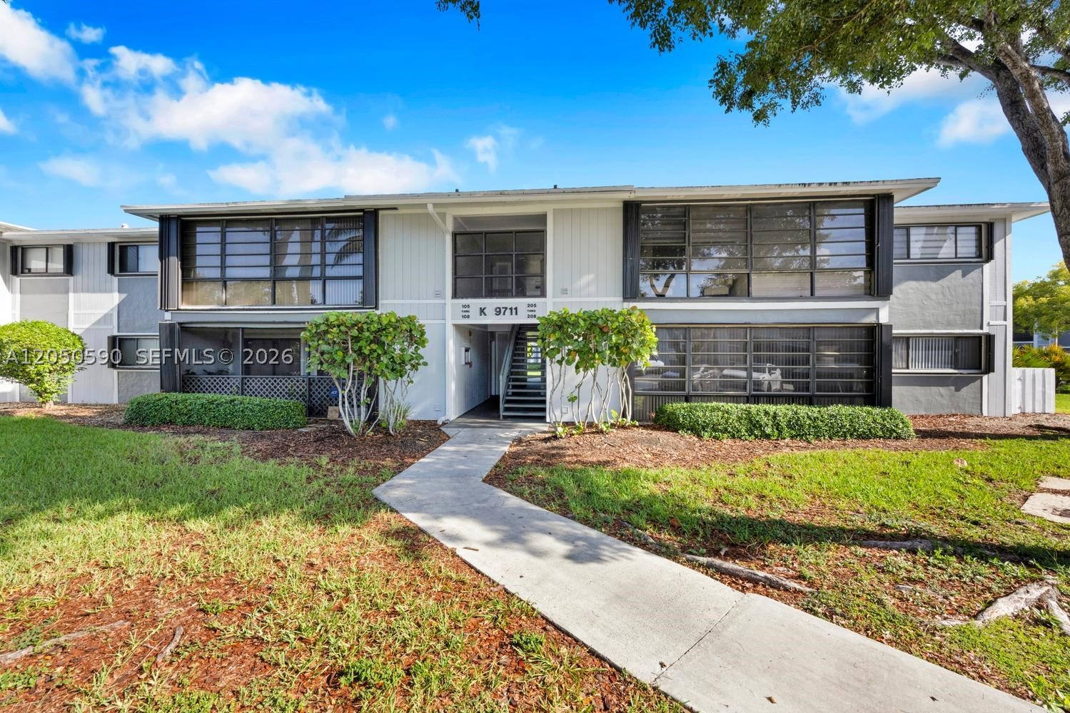 Spacious 2-bedroom, 2-bath condo located in the Hammocks community of Lakeview. This lovingly maintained unit features walk-in closet, lots of natural light, in-unit laundry, a bright living/dining area, enclosed balcony area, accordion shutter. The community offers lakefront paths, clubhouse, fitness center, tennis courts, and multiple pools. Conveniently located near shopping, schools, and major roadways.