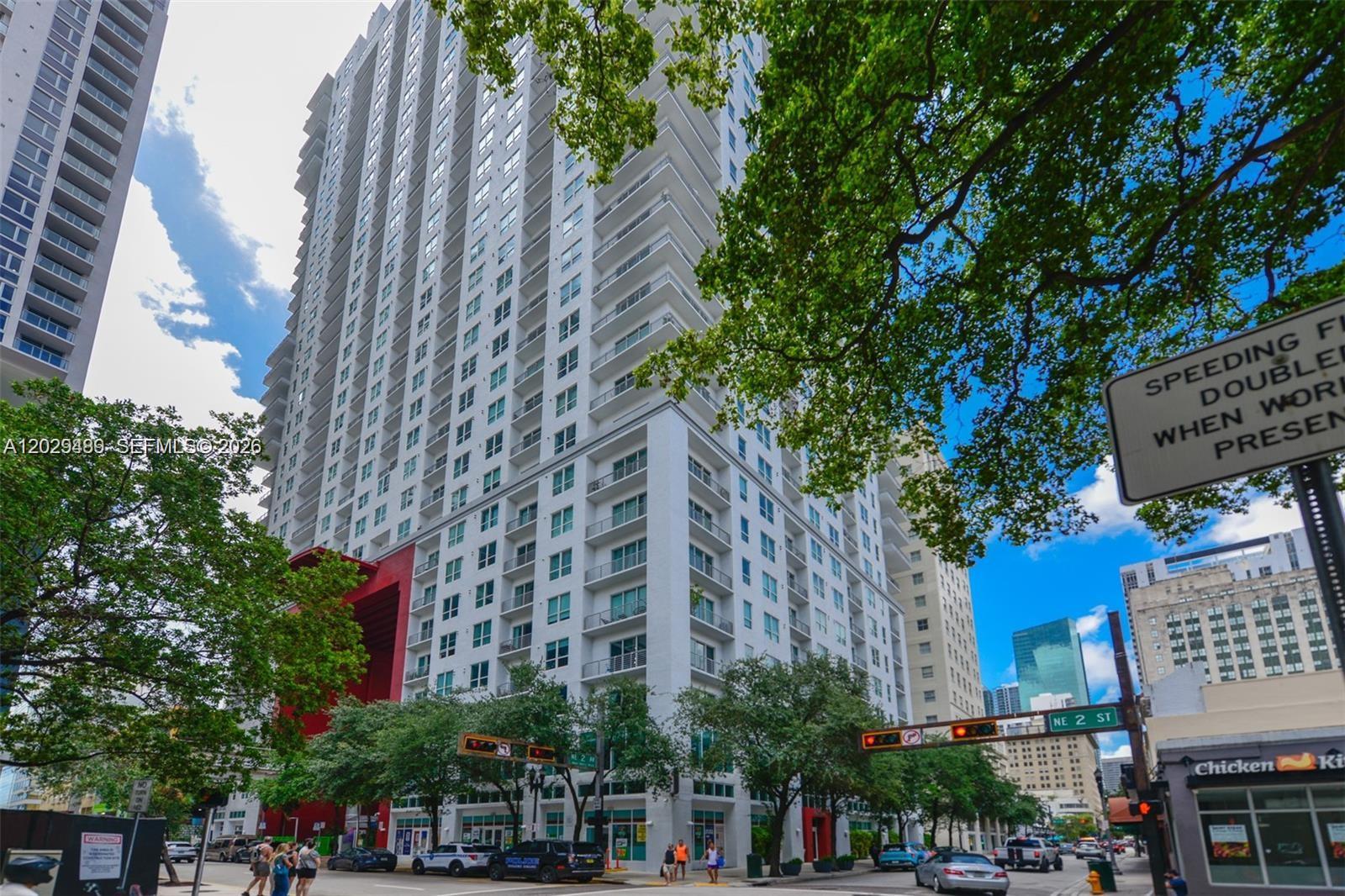 Modern loft-style 1BD/1BA residence in the heart of Downtown Miami. This high-floor unit features soaring ceilings, polished concrete floors, abundant natural light, an open layout, and a private balcony with stunning city and sunset views. The European-style kitchen offers granite countertops and stainless steel appliances, plus an in-unit washer/dryer. Enjoy resort-style amenities including a rooftop pool, fitness center, spa, lounge, 24-hour concierge, and security. Basic cable and internet included. Conveniently located with direct MetroMover access and within walking distance to Miami Worldcenter, Miami Dade College, Bayside Marketplace, Kaseya Center, shopping, dining, and entertainment. Minutes from Brickell, Miami Beach, and Miami International Airport. Parking available nearby for approximately $60/month.