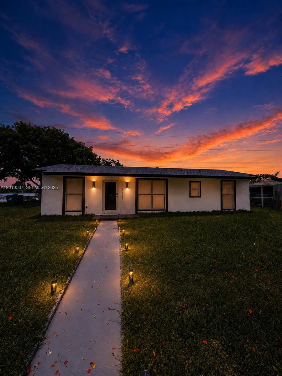 Fully renovated waterfront home in Miami Gardens featuring stunning lake views and high-end upgrades throughout. This move-in ready property offers brand new impact windows and doors (2025), new roof (2025), new plumbing, new A/C system ready to be used for the first time, renovated kitchen, modern bathrooms, and new flooring throughout the entire home. The open layout is filled with natural light and showcases beautiful water views from the primary bedroom, living room, and kitchen. Enjoy outdoor living with a spacious lakeside terrace perfect for entertaining, relaxing, or enjoying the South Florida lifestyle. The oversized backyard offers plenty of room for a future pool while still providing space to park a boat, RV, or additional vehicles on the side of the property. Additional features include a detached storage structure in the backyard, updated finishes throughout, and direct waterfront ambiance rarely available at this price point. Perfect for primary residence, vacation home, or investment opportunity.