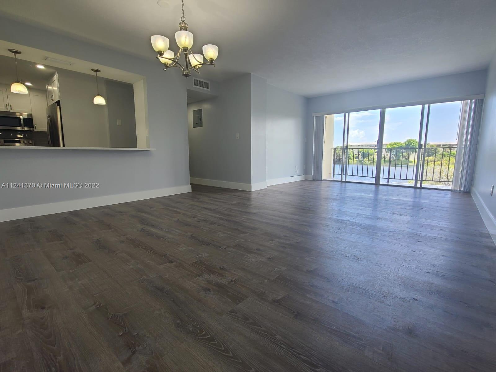 Spectacular 3/2 in Fontainebleau with over $80,000 of brand new upgrades! New kitchen with quartz countertops, new bathrooms, new waterproof vinyl flooring, impact windows in all bedrooms, new custom closets, new electric panel and more! Sit back and enjoy your amazing lake view from every room!! This spacious, corner unit condo has tons of storage throughout. Will not last!!