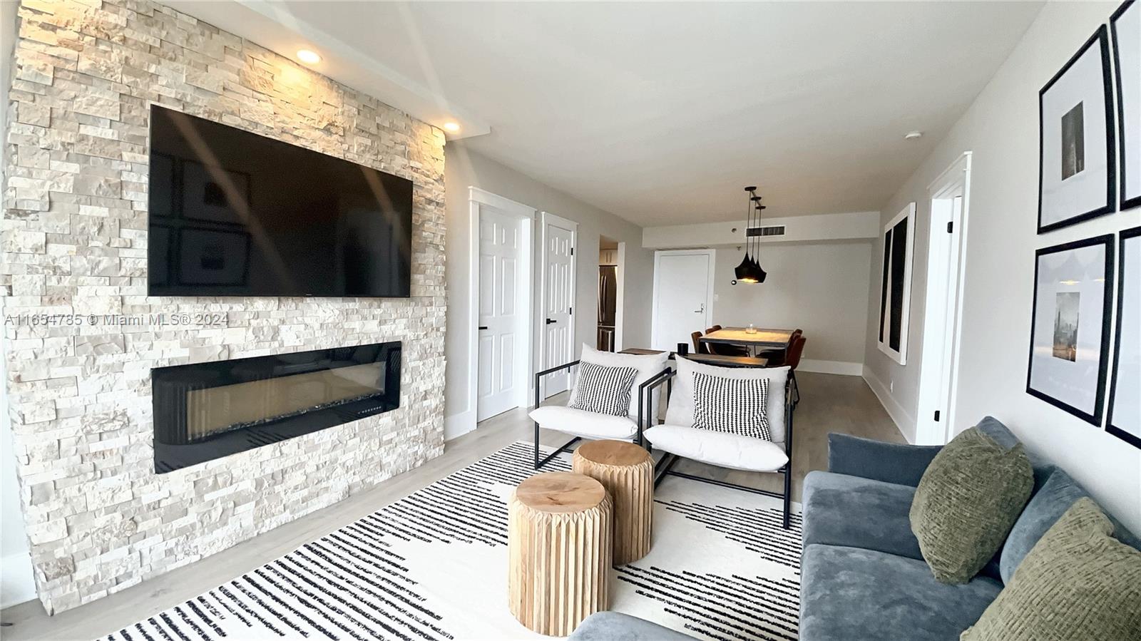 Experience modern living in this fully furnished, beautifully remodeled 2-bedroom, 2-bathroom condo. High-quality finishes include elegant flooring, custom cabinetry, and modern fixtures throughout. The spacious kitchen is a chef's dream with stainless steel appliances, quartz countertops, and ample storage. Enjoy the convenience of an in-unit washer and dryer. The east-facing unit offers stunning ocean and Turnberry Golf Course views. Located just a minute from the ocean and close to supermarkets, Aventura Mall, and more. The building features a sleek, modern lobby, a large gym, and two swimming pools. Covered parking is included. This condo is the perfect blend of luxury, comfort, and convenience.