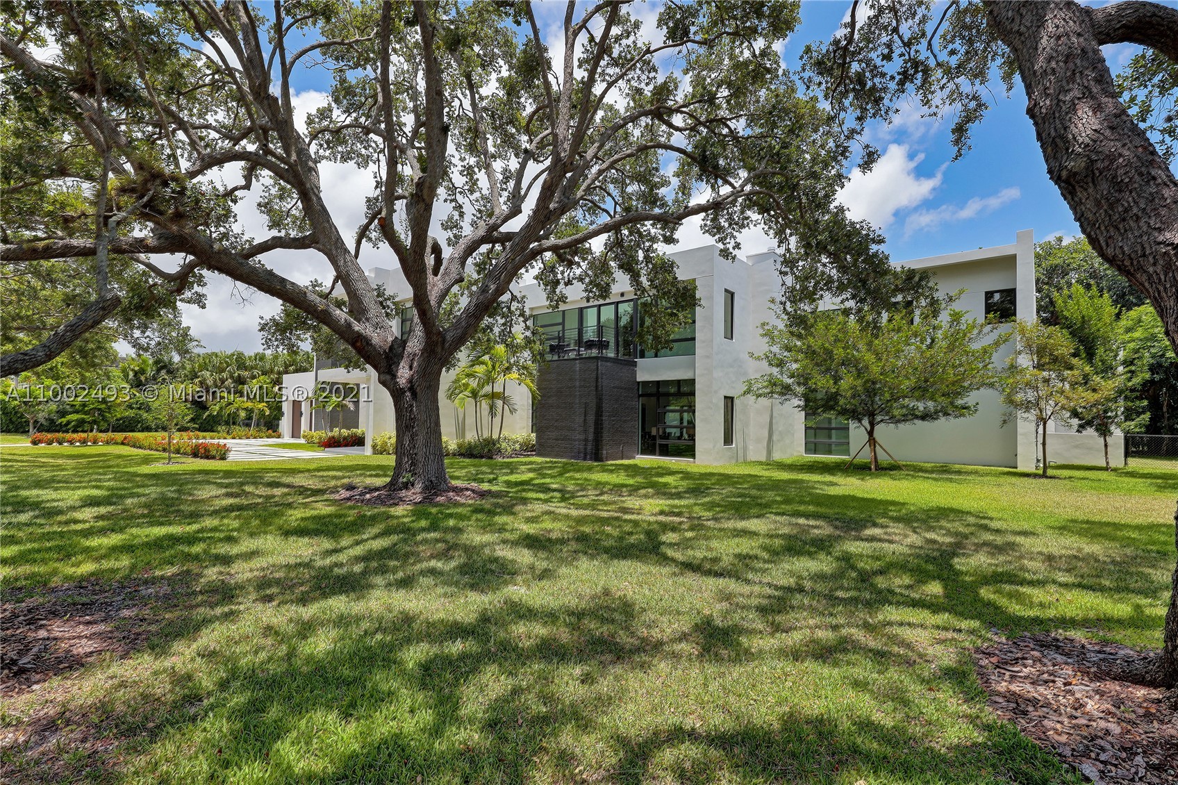 Stunning! This modern masterpiece is crafted with European-style finishes. Featuring an architectural glass facade on both the North and Southside of the home; Uniquely designed with a focus on an open concept. Custom entertainment style kitchen includes Wolf & SubZero appliances, oversized pantry, and family room with access to the pool/spa. Six of the seven bedrooms are ensuite with closets. The corner master suite includes a royal shower, his/her closets, dual vanities, a balcony, and a private outdoor staircase. Additional particulars- Contemporary glass wine room, summer kitchen, and 2 car garage. Flood zone X. Porcelain floors throughout. Just under 9000 total sqft. Located on a private quiet street close to Pinecrest's award-winning schools just 25 minutes to the MIA airport!