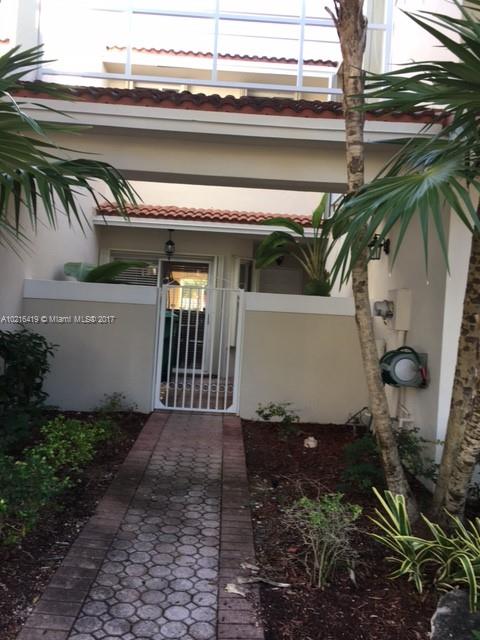 INMACULATE TOWNHOUSE IN DESIRABLE GATE COMMUNITY OF DORAL CHASE , private back patio, one car garage, tiled first floor, remodeled kitchen the stars and second floor are  carpet