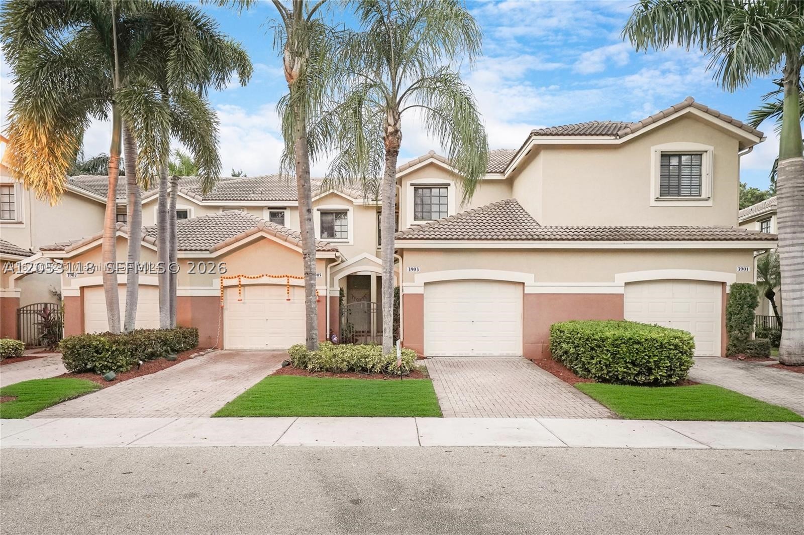 Beautifully remodeled, move-in ready townhouse in a gated community. Features a remodeled kitchen, updated guest bathroom, ceramic tile downstairs, laminate flooring upstairs, washer and dryer, and a newly tiled patio with a peaceful garden view. Includes a one-car garage, private driveway, and guest parking across the street. Enjoy community amenities including a pool and playground. Prime location near major highways and within WALKING  distance to Cypress Bay High School, Falcon Cove Middle School, and the Weston Library. Zoned for top-rated schools, including Manatee Bay Elementary. Don't miss this exceptional rental opportunity!