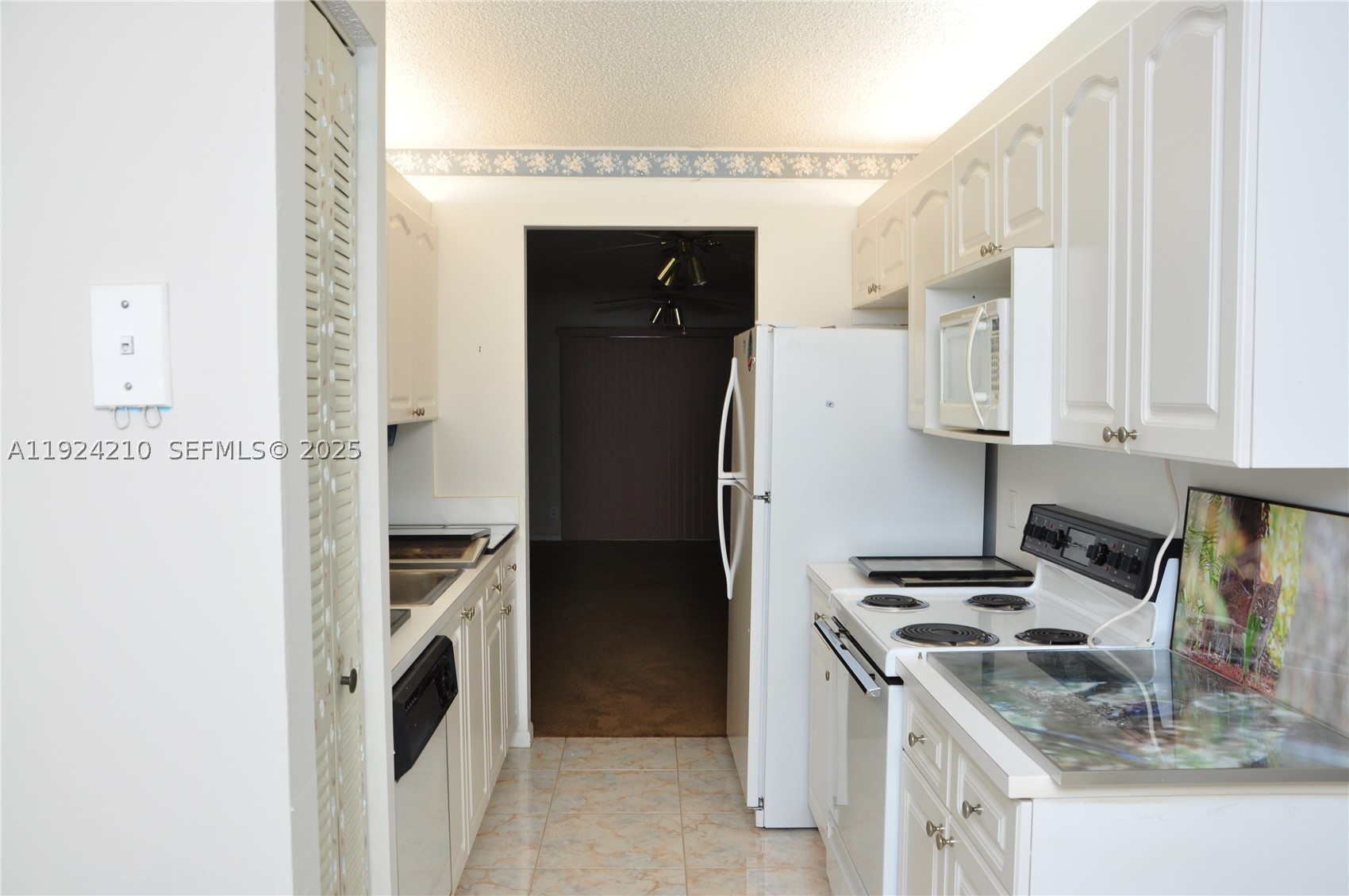 Freshly painted 2BR/2BA condo in desirable Century Village. Features impact windows and shutters, spacious living areas, and a well-maintained interior. Enjoy clubhouse, pools, fitness center, and numerous community amenities. Conveniently located near shopping and dining. Sold As-Is with right to inspect. EASY TO SHOW!