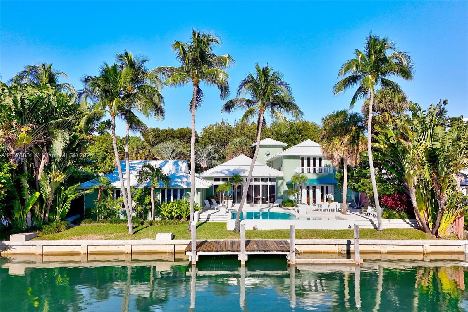 Location is everything, as this home proves it!  Besides being located on the quiet end of Island Dr. this gorgeous designer waterfront home looks down the length of the canal (not directly into the home on the opposite side). Minutes to open Bay for marvelous boating. Exquisite Sunsets lending to fabulous entertainment venues.  Enter through the walled sanctuary fountain garden. The 2nd floor is exclusive for the Primary Bedroom Suite. Pool & canal views from the majority of the home. 2 car garage plus circular driveway.  2,020 Sq ft of house built in 1967 but the majority, of an additional 3,946 sq ft, was built in 1991 & has had continual updates (Impact Glass/Sky Lights/New metal roof in 2020 etc.) Tranquil waterfront Key Biscayne gem. A pleasure to show.