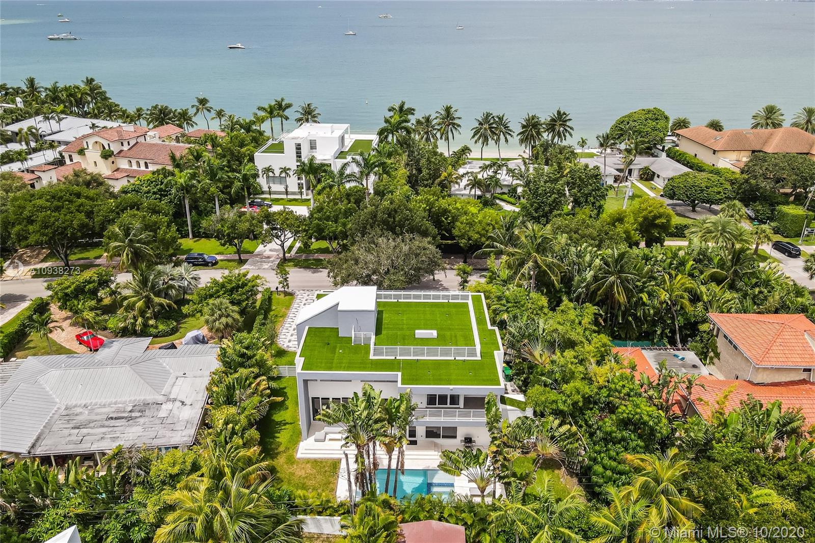 Extraordinary brand new home located on exclusive Harbor Dr. with an incredibly oversized lot. This modern home has a very open floor plan and features 7 bedrooms, 7 full bathrooms plus a powder rooms. An elegant elevator offers access to all 3 floors and a stunning roof top terrace with bay views and ocean breeze ideal to enjoy sunset cocktails or sunbath. Wonderful driveway and carport allow you to fit several cars.  Enjoy your spectacular pool and ample garden are with Jacuzzi, Cabana bathroom and a fantastic terrace to entertain. **SEE VIDEO IN VIRTUAL TOUR**