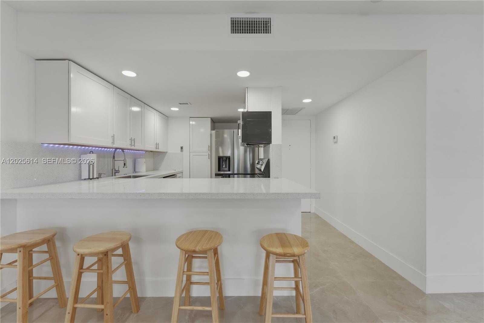 A Brand new fully renovated & furnished 2-bedroom, 2-bath residence featuring never before used appliances, modern flooring, and stylishly updated bathrooms. This move-in-ready home also includes the convenience of an in-unit washer and dryer, all located within a quiet, peaceful gated community offering comfort, privacy, and a serene living environment.