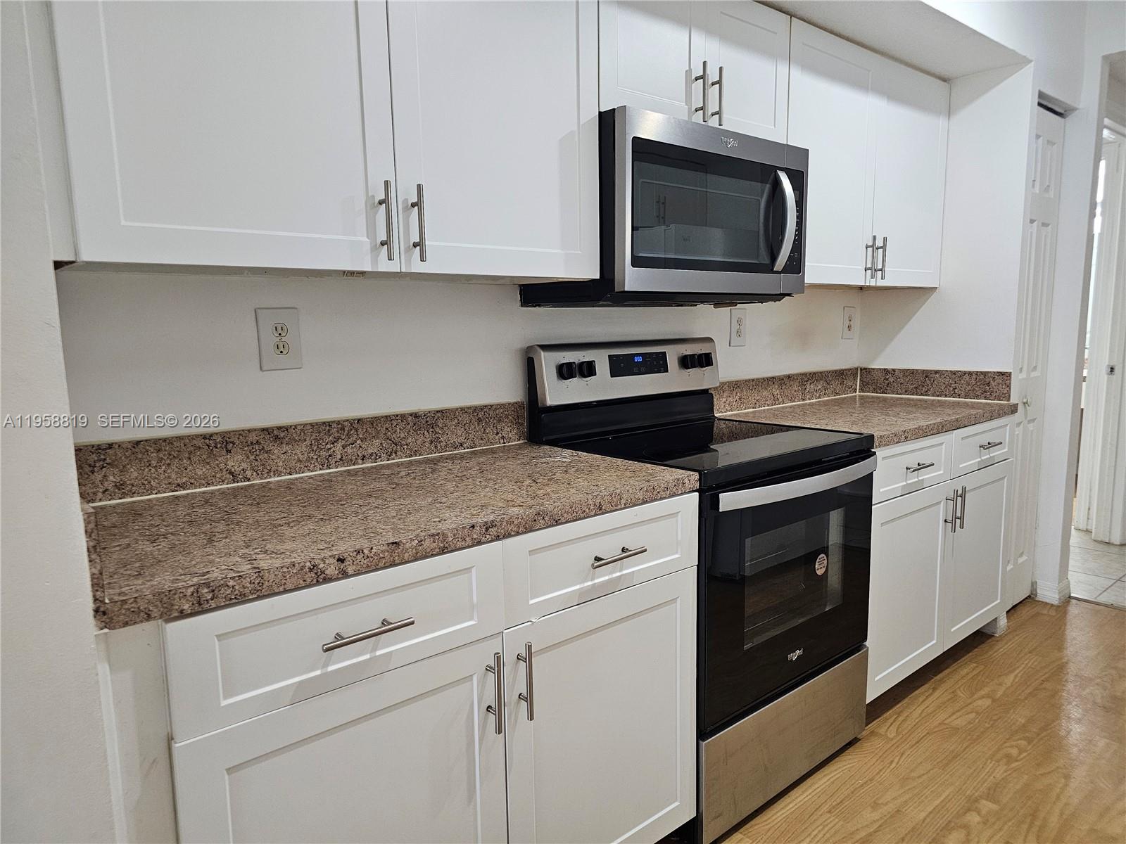 Beautiful 2 bedrooms 2 bathrooms located on the first floor with an amazing garden view! Updated appliances!  Ceramic tile in all living areas. Washer and dryer in unit. 3 walk-in closets! 2 parking spaces.
