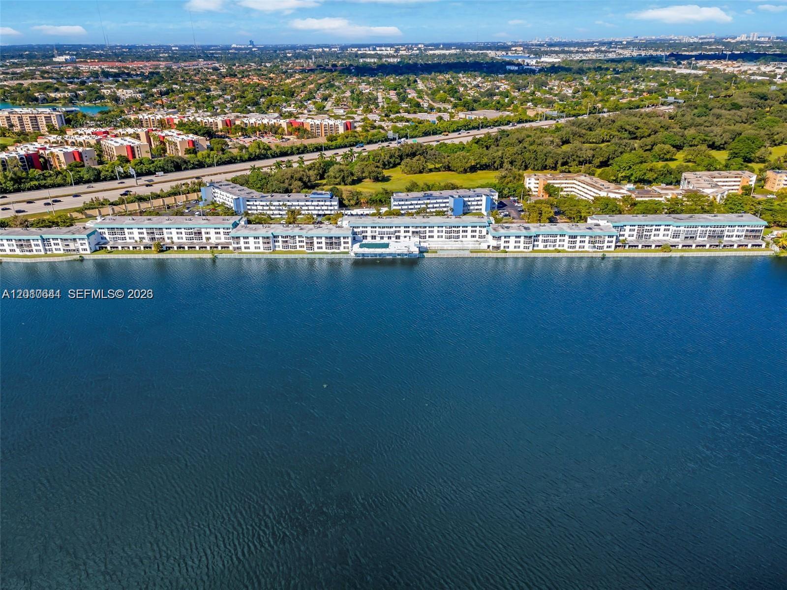 Spacious 1 Bed / 1.5 Bath residence with serene canal views. Includes a flexible office/den space ideal for a home office or guest area.  Located in a prime area just minutes from Publix, shopping, dining, and major highways. Excellent opportunity for both end-users and investors. Priced to sell and will not last.  WITH NEW IMPACT WINDOW, NEW ROOF, NEW ELEVATORS, AND FRESH PAINT. HOA $553.46, includes : water,trash, pest control. Special assessment $254.95 (Negotiable). Excellent opportunity for first-time buyers to own their dream home! Spacious layouts with a loft of natural light, walk-in closet and a private balcony overlooking.