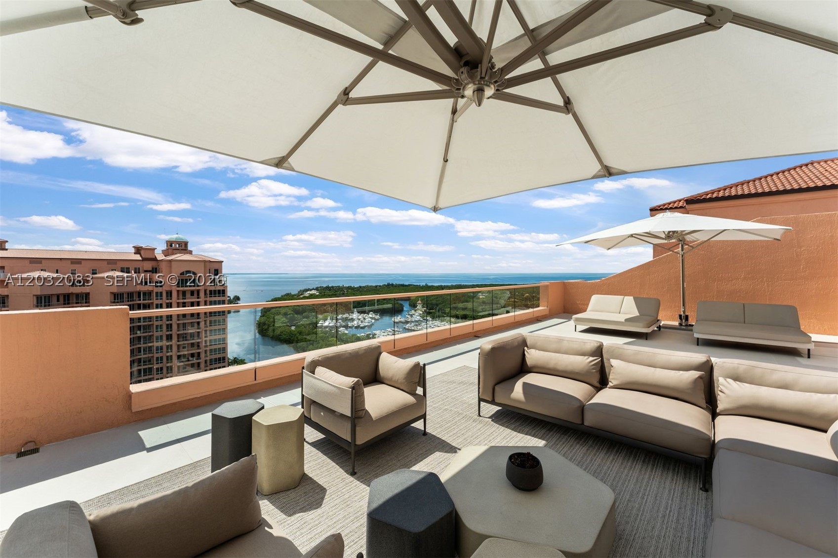 Rarely available two-story penthouse in Tower II at The Gables Club, one of Coral Gables' most exclusive waterfront communities. Recently completed top-to-bottom renovation with all-new electrical, plumbing, HVAC, and premium finishes throughout, offering a truly turnkey living experience. This residence features 3 bedrooms, 4 full baths, 2 half baths, private elevator access to both levels, and breathtaking panoramic views of Biscayne Bay, the marina, and the Miami skyline. Thoughtfully curated interiors showcase white oak flooring, custom millwork, Venetian plaster finishes, architectural wall paneling, and floor-to-ceiling impact glass opening to expansive terraces. The chef's kitchen features a marble waterfall island, custom cabinetry, Sub-Zero, Wolf, and Miele appliances, and a walk-in pantry. Entertain with ease in the formal living and dining rooms, a private family room, hidden wet bar with wine refrigeration, and a dedicated home theater. The primary suite occupies the main level and includes a sitting area, private gym, dual spa-inspired bathrooms, and custom walk-in closets. Upstairs offers two en-suite guest bedrooms, a second full kitchen, family room, and an extraordinary terrace featuring lounge areas, a fire pit, and a summer kitchen. Additional features include Lutron lighting, Sonos audio, four assigned parking spaces, a private garage, EV charging, storage, and a separate 1-bedroom, 1.5-bath guest suite. Residents enjoy concierge services, a marina, tennis courts, a restaurant, spa, fitness facilities, heated pools, and 24-hour security.