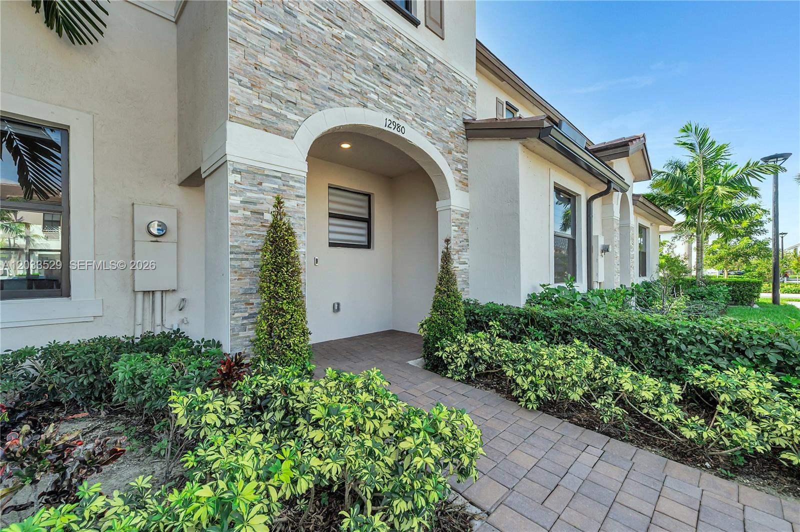 South Florida living at its best! This former builder model has never been lived in and is perfect as a starter home, second home, or investment. The 3BR/2.5BA layout offers modern comfort with a sleek kitchen featuring stainless steel appliances, a fenced rear yard, and a spacious primary bath with walk-in shower. Furniture not included but negotiable. Enjoy affordable HOA fees and great amenities including a clubhouse, fitness center, pool, and tot lot. Square footage approximate.