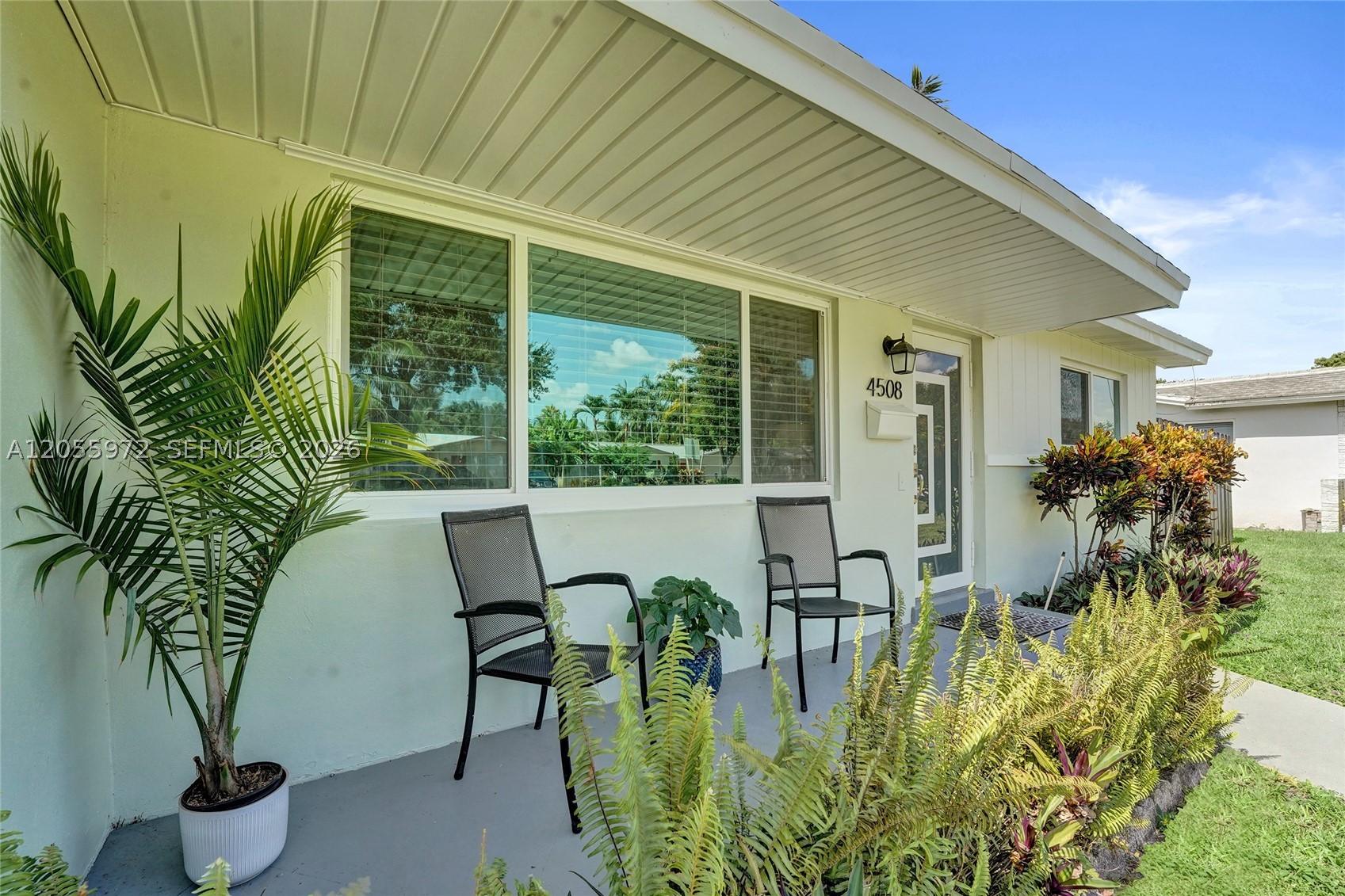 Welcome to this renovated, 3 bedroom, 2 bath home, on an oversized lot with plenty of room for pool, located in the heart of Hollywood Hills. This move-in-ready home seamlessly blends classic character with modern upgrades, offering the perfect setting for family living. Step inside to discover original terrazzo flooring flowing throughout the living room, dining room, kitchen, family room and home office — a timeless feature that adds warmth and authenticity throughout the main living spaces. The three bedrooms feature engineered wood plank flooring, offering a modern, low-maintenance touch.

The tiled, screened-in lanai extends your living space outdoors, creating an ideal spot for relaxing evenings, entertaining guests, or watching the kids play — rain or shine. Plus the outdoor patio and oversized lot provide plenty of room for outdoor activities as well as room for a pool. Upgrades include: newer roof, all hurricane impact windows and doors, new kitchen and baths. This home is a must-see!