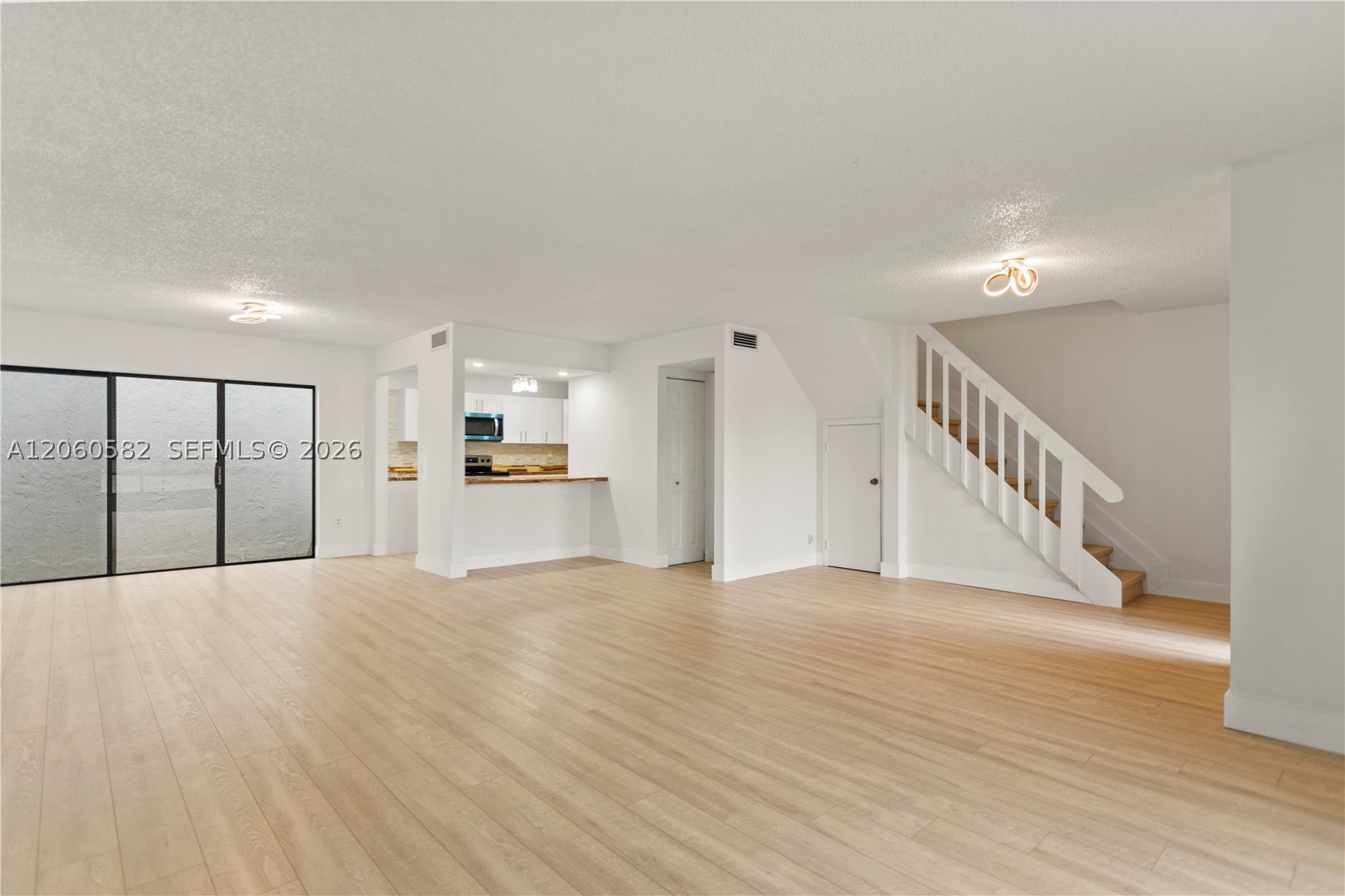 LARGE OPEN CONCEPT 1600 SQFT LAKEFRONT 2 STORY. TOWNHOME. FIRST FLOOR BOASTS A FULLY REMODELED KITCHEN WITH NEW STAINLESS APPLIANCES INCLUDING A WASHER AND DRYER, ATRIUM GARDEN, HALF BATH AND A SCREENED PATIO. UPSTAIRS HAS 3 LARGE BEDROOMS 2 FULL BATHROOMS WITH WALK IN CLOSET AND BALCONY OFF THE PRIMARY ROOM. THIS IS THE NICEST LOCATED UNIT IN THE ENTIRE COMMUNITY AS YOU CAN SIT ON YOUR PATIO AND WATCH THE SUNSET OVER THE LAKE. THIS HOME IS 1 BLOCK FROM MIAMI LAKES, THE PALMETTO AND ALL THE SHOPPING AND RESTAURANTS YOU CAN ASK FOR. IT ALSO COMES WITH 2 RESERVED PARKING SPACES.