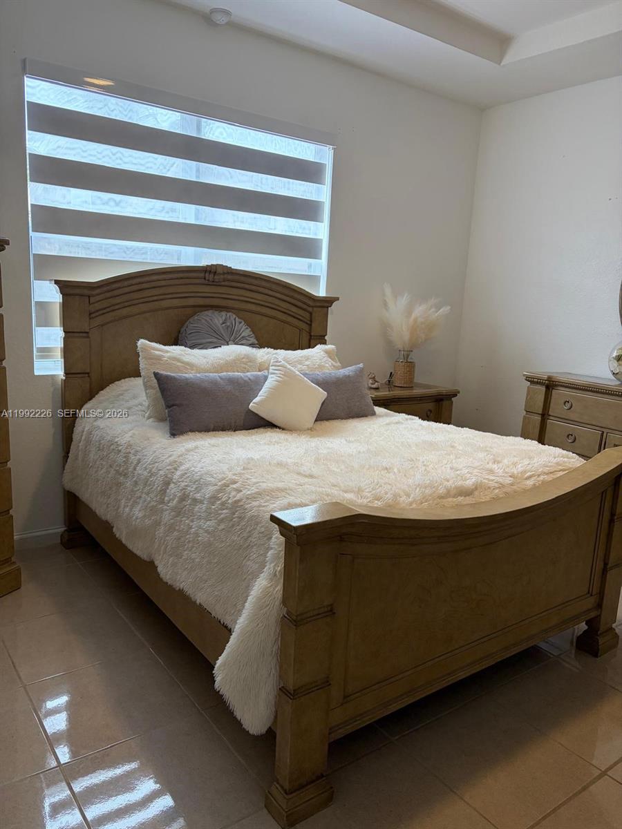Beautiful and spacious 3-bedroom, 2-bath single-family home located in the highly sought-after Hemingway Point community. This well-designed home features a functional split floor plan, with two bedrooms and a full bath situated on one side of the home, while the private primary suite is tucked away for added comfort and privacy. The primary bedroom offers dual closets and an en-suite bathroom complete with both a tub and separate shower. Enjoy the convenience of a 2-car garage, impact-resistant front and rear doors, and hurricane shutters throughout the remainder of the home. Situated in a well-maintained community with very low HOA fees, this property offers both value and peace of mind.