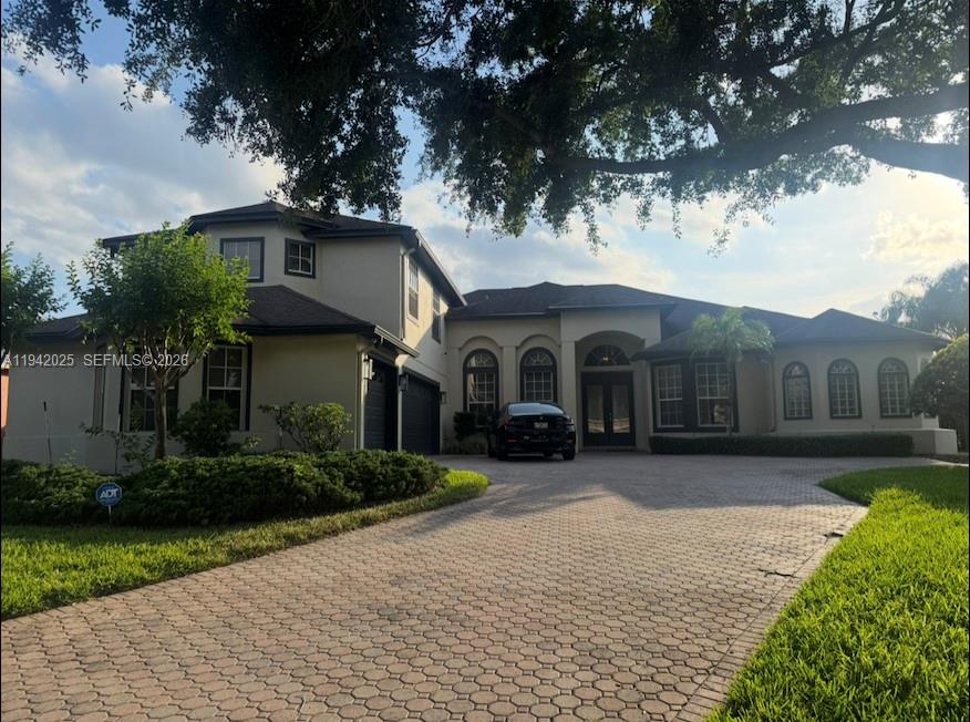 MOTIVATED SELLER! Accepting Offers! Discover an exceptional opportunity just 10 minutes from Walt Disney World. This beautifully designed Orlando home offers 5 spacious bedrooms plus a den, 4 full bathrooms and a half bath, ideal for both family living and entertaining. The open layout is filled with natural light and flows seamlessly to a private backyard oasis featuring a sparkling pool, perfect for enjoying Florida living year-round. A 3-car garage provides ample space for vehicles and storage. Whether you’re seeking a primary residence, vacation retreat, or investment property, this home delivers comfort, functionality, and an unbeatable location close to world-class attractions, dining, and shopping. A must-see property in one of Orlando’s most desirable areas. Features oversized 14,375 SqFt Lot with many upgrades: Freshly painted, Removable pool safety fence, brand new patio screen enclosure, brand new AC Unit, Backyard privacy Hedges. BRAND NEW 2026 Roof will be installed prior to closing, paid by Seller. Seller can choose Roof color.