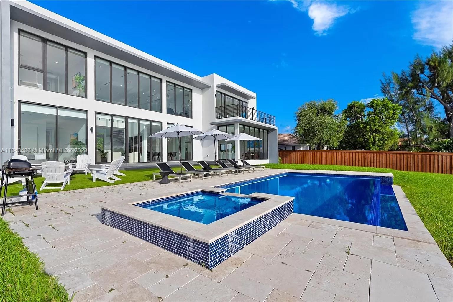 A modern lakefront masterpiece. Inspired by Miami Beach's waterfront mega-mansions, this home sits perfectly
situated on Marina Lake. Perfectly located in the center of Miami, with sunset views over a tranquil view of earth
and water. You could not get a better combination. Features high ceilings with floor to ceiling impact windows, a
second-floor catwalk, elegant double-height foyer, open floor plan, large kitchen with top of the line appliances,
extraordinary finishes throughout, infinity pool, two of 5 rooms on the first floor, lake views from all of the rooms
& more! Home sits on a 24,600 sqft lot with 122ft linear ft on the water and 4,534 sqft under AC. Minutes off the 826, Coral Gables, Restaurants, schools, shopping & more! Ladies & Gentleman. Your new home awaits