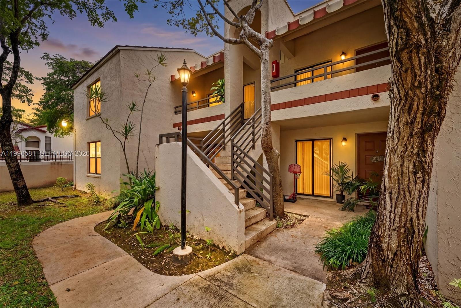 Beautifully maintained 2/2 condo in the gated Quatraine community. This quiet corner unit features a desirable split floor plan and an open kitchen layout. In-unit washer and dryer, 24/7 guard-gated security, and a well-managed association with funded reserves and new roofs. Residents have access to great amenities including a pool and jacuzzi. HOA covers water, cable + HBO