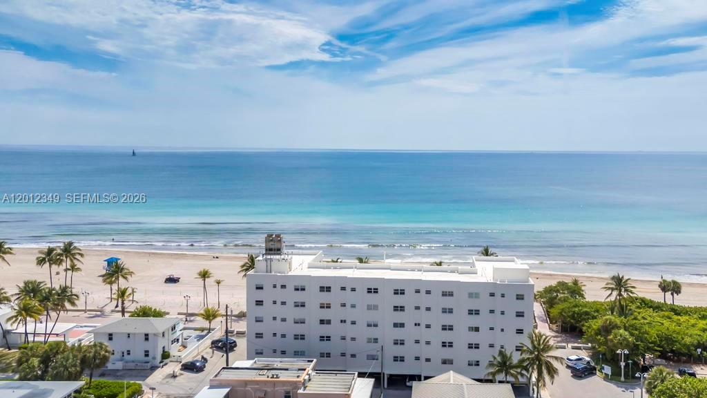 Gorgeous, light-filled 1-bedroom, 1-bath direct oceanfront residence at the quiet southern end of the Hollywood Beach Broadwalk. This completely renovated unit features impact windows and doors, an eat-in kitchen, and breathtaking, unobstructed Atlantic Ocean views from both the living room and kitchen. Enjoy vibrant sunrises, ocean breezes, and the soothing sound of waves just steps from the sand, with direct beach access and a peaceful setting with minimal traffic. Ideal as a primary residence, vacation getaway, or income-producing seasonal retreat. The building has successfully completed its 50-year recertification, with no ongoing construction and no assessments. An exceptional opportunity to own a worry-free piece of South Florida paradise.
