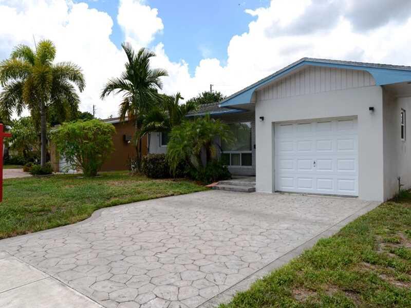 Spacious 3bed 2bath home with tile flooring through t/out. Large florida room for entertaining which leads out to the screened in patio.  Fully fenced backyard with extra entrance off back alley ideal for a boat or RV there is also space for a pool.ALL wi ndows are high impact glass and home comes with an alarm system. This is a great value within a great neighborhood and schools. This home offers plenty of space for a growing family indoor and outdoor!  Make an offer today!  Quick Response! Move in Soon!