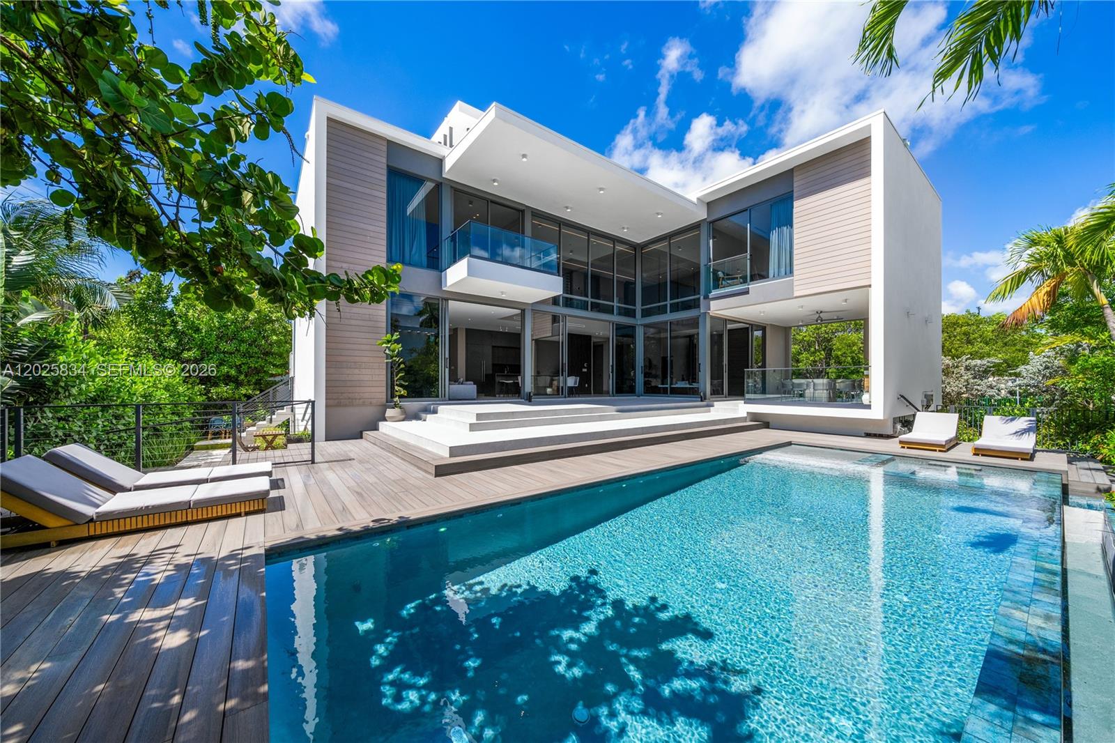 BRAND-NEW CONSTRUCTION HOME IN ONE OF KEY BISCAYNE’S MOST PRESTIGIOUS AND PRIVATE ENCLAVES SURROUNDED BY LUSH TROPICAL LANDSCAPING! This exceptional Contemporary Residence offers 5 Bedrooms with a service area, 5.5 Bathrooms + a Cabana Bath. 3,768 Interior SF on a Lush Corner Lot on a quiet street. Soaring double-height ceilings & expansive impact glass windows that fill the interiors with abundant Natural Light. The Home offers Enhanced Privacy and an Impeccable Floor Plan designed for modern living & entertaining. Gourmet eat-in Kitchen with Custom Cabinetry & top-of-the-line Miele Appliances. Spacious Outdoor Spaces include a Private Rooftop Terrace with a summer kitchen, newly designed gardens, beautifully landscaped grounds, and a Resort-style Pool enveloped by Lush Greenery. Perfectly located just moments from the Beach, Parks, Restaurants & Key Biscayne’s top-rated schools, this residence combines timeless design, exclusivity & an unparalleled island lifestyle
