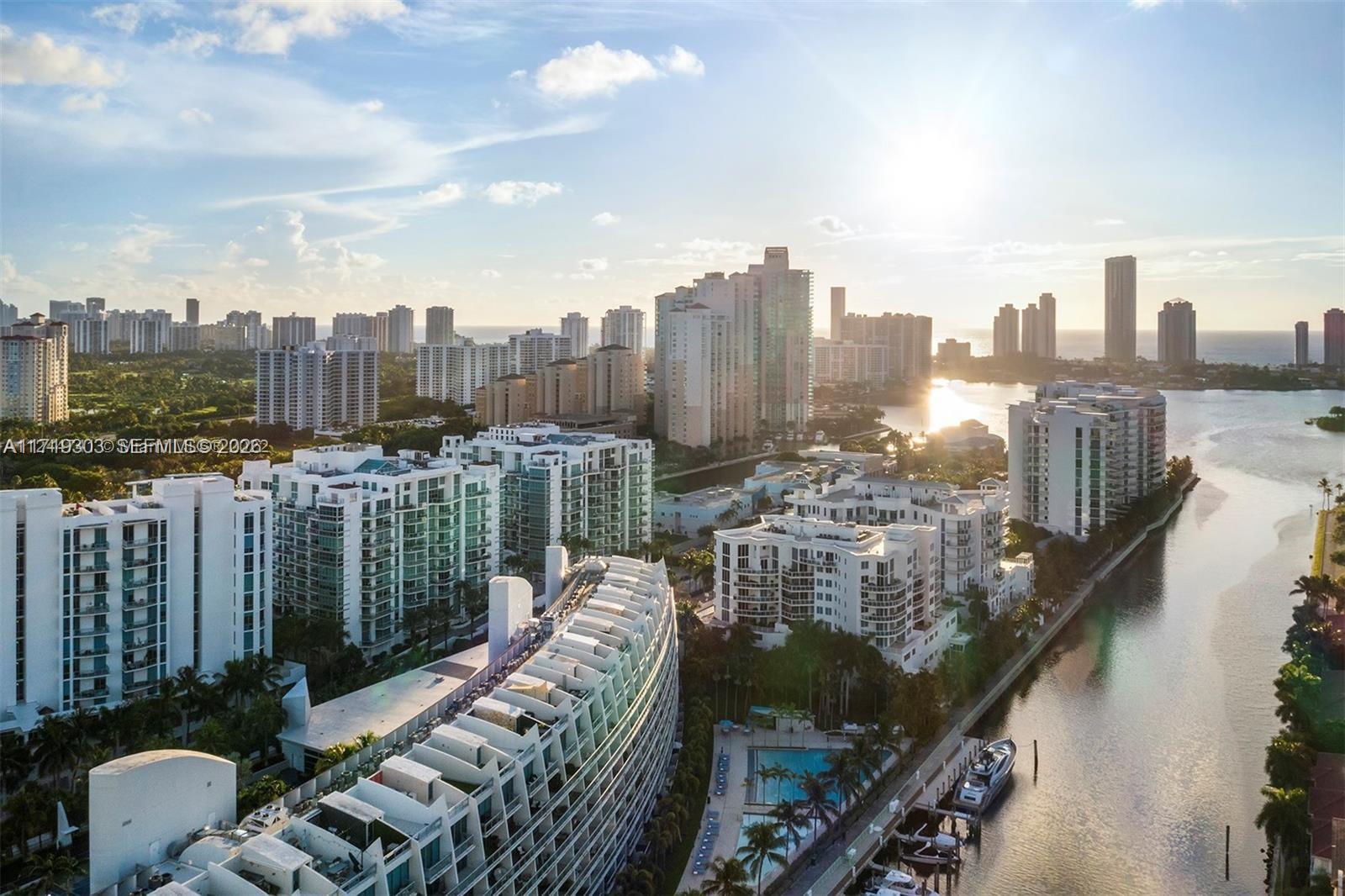 Rare opportunity to live in one of Aventura’s most unique waterfront residences at Artech Residences at Aventura.This beautifully designed 2-story loft-style condo offers the rare feeling of living in a private home while enjoying the convenience of luxury condominium living. Featuring 1 bedroom + den, 2 full bathrooms, and 1,100 sqft + private balconies, this residence showcases peaceful intracoastal water views, soaring double-height ceilings, ceramic flooring, and an in-unit washer/dryer. The spacious den is perfect as a home office, guest room, or nursery/second bedroom. The upstairs primary suite offers privacy and comfort, while the dual-level layout creates a unique townhouse feel rarely found in Aventura condos. Residents enjoy resort-style amenities including: 2 tennis courts, state-of-the-art fitness center, yoga, dance & spinning studios,racquetball court, spa + dry & steam saunas,beach-style pool + semi-Olympic pool,movie theater,marina access,private bike storage,24-hour concierge, valet & security. Perfectly located in the heart of Aventura: * 5 minutes to Aventura Mall * Minutes to Publix and The Fresh Market * 10 minutes to Whole Foods Market, Target, and Brightline * Conveniently located between Miami International Airport and Fort Lauderdale-Hollywood International Airport * Close to beaches, top dining, and excellent schools For tennis lovers: the unit also includes a Slinger tennis machine, making daily practice even easier.