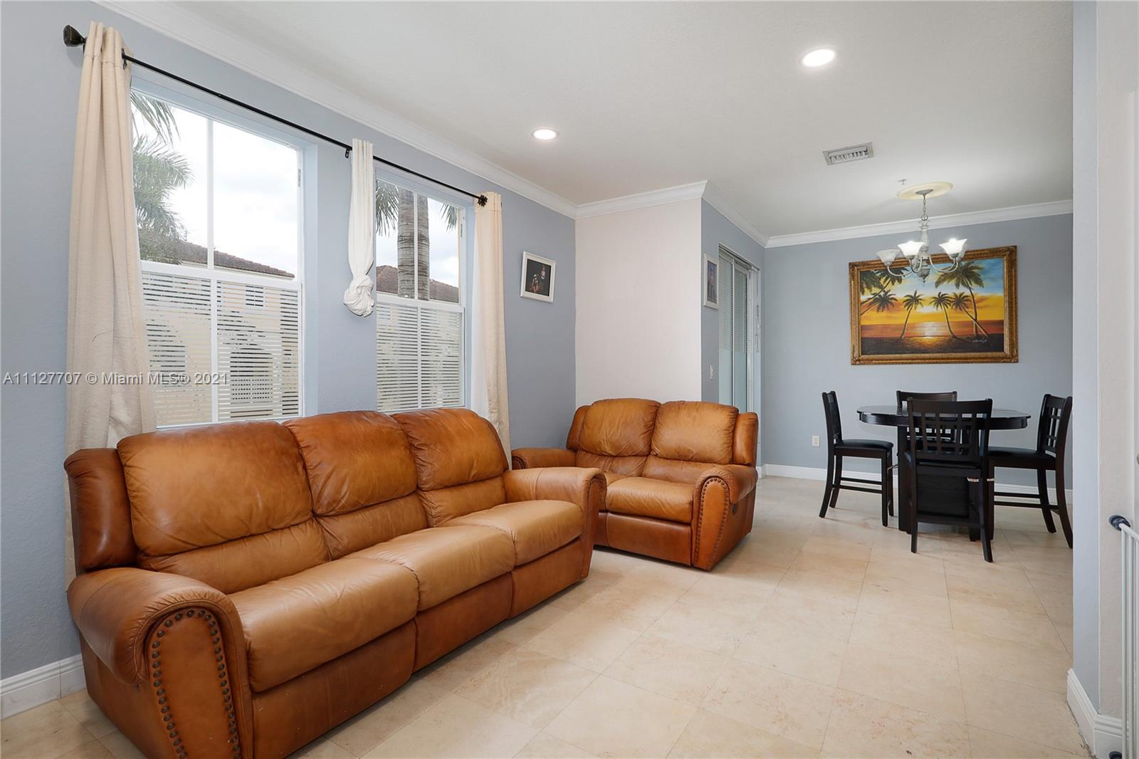 Beautiful and well maintained 2 bed 2.5 bath condo w/ a townhouse type of feel in the secure and gated community of Courtyards at Nautica. Situated on the second floor this home features a brand new A/C unit, stainless steel appliances, marble tile floors on the 1st floor and a flowing layout that includes a formal dining room overlooking the balcony along with a family room adjacent to the kitchen, great and convenient for family gatherings. The half bathroom downstairs and washer/dryer compliment the main floor. Top floor consists of two very good size bedrooms each with their own en-suite bathrooms. Walk-in closet with shelving add extra space to the main bedroom. Excellent location in West Miramar, close to shopping, dining and main highways to get you anywhere you need to be.