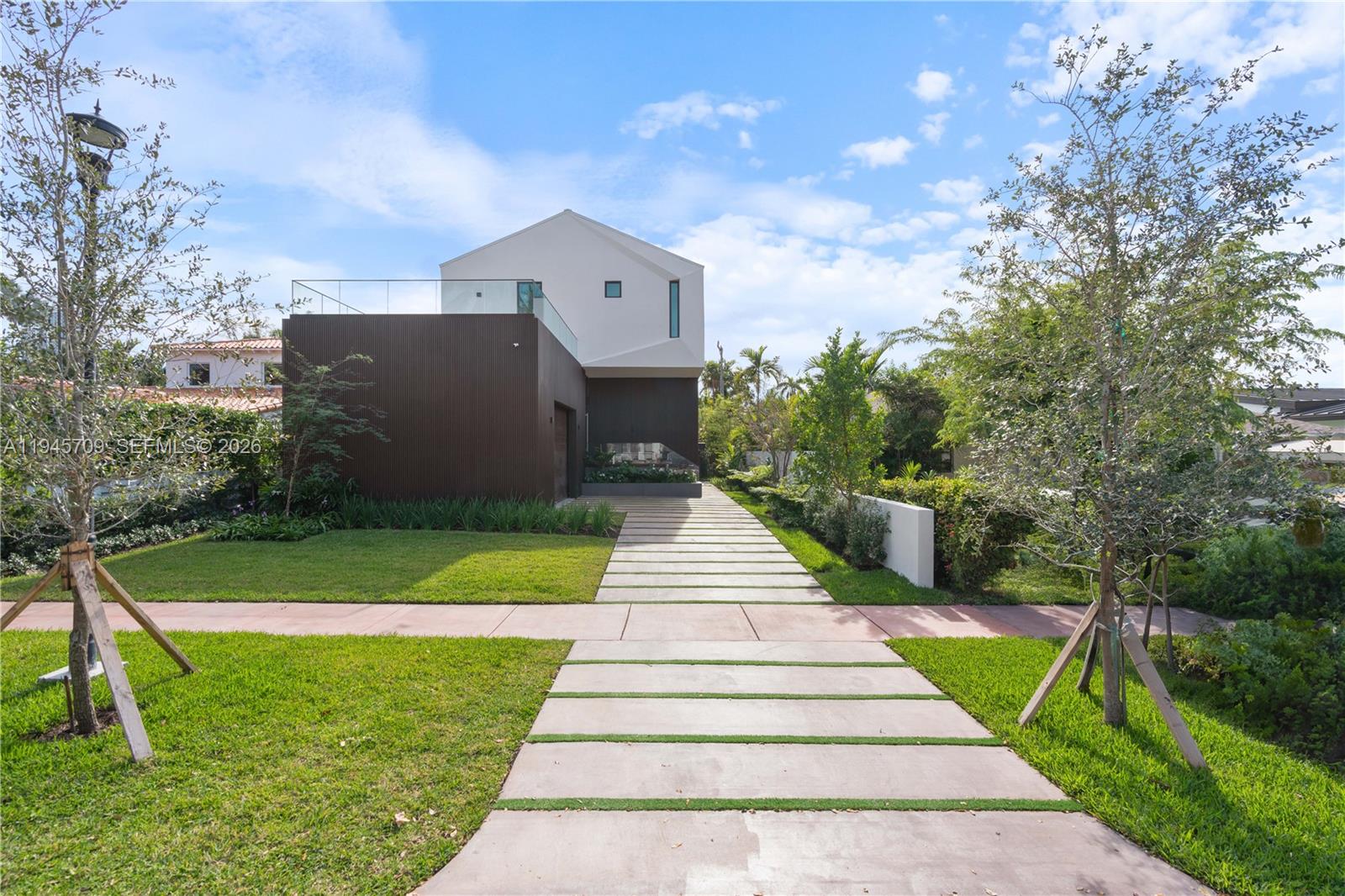 BRAND NEW CONSTRUCTION! Experience the pinnacle of Miami Beach living in the highly sought-after Lakeview community. This newly constructed residence showcases a bright open-concept layout anchored by a top-of-the-line Italian chef’s kitchen featuring a gas range and elegant marble countertops. The serene backyard oasis is thoughtfully designed with lush landscaping, a sparkling pool, and a built-in BBQ—ideal for both relaxing and entertaining. Additional highlights include floor-to-ceiling hurricane-impact windows, chevron wood flooring, and custom-built closets throughout. Ideally located just a short stroll from Fisher Park and minutes from Sunset Harbor and pristine beaches, this exceptional home seamlessly blends luxury, comfort, and convenience.