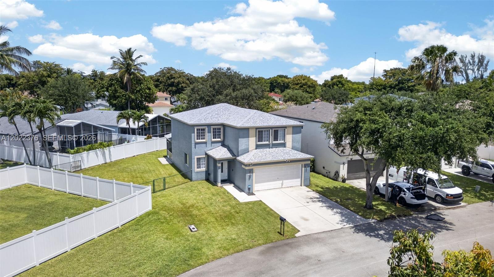 Tucked within the highly desirable Waterways community, this spacious two-story residence offers the perfect blend of comfort, functionality, and South Florida living. Situated on an oversized fenced lot with exceptional privacy, this 4BR/2.5BA home features soaring ceilings, abundant natural light, and an inviting layout ideal for both everyday living and entertaining. Formal living and dining spaces are complemented by an expansive family room and an updated kitchen featuring modern cabinetry, stone countertops, stainless steel appliances, and generous prep space. A convenient main-level half bath adds everyday practicality. Enjoy seamless indoor-outdoor living with a covered screened patio overlooking the expansive private backyard with plenty of room to entertain, relax, or add a future pool. Major updates have already been completed, including a newer roof, A/C, water heater, and updated appliances, offering true peace of mind. Residents of The Waterways enjoy low HOA fees, a community pool, playground, scenic surroundings, and a prime Deerfield Beach location close to shopping, dining, major highways, parks, and beaches.