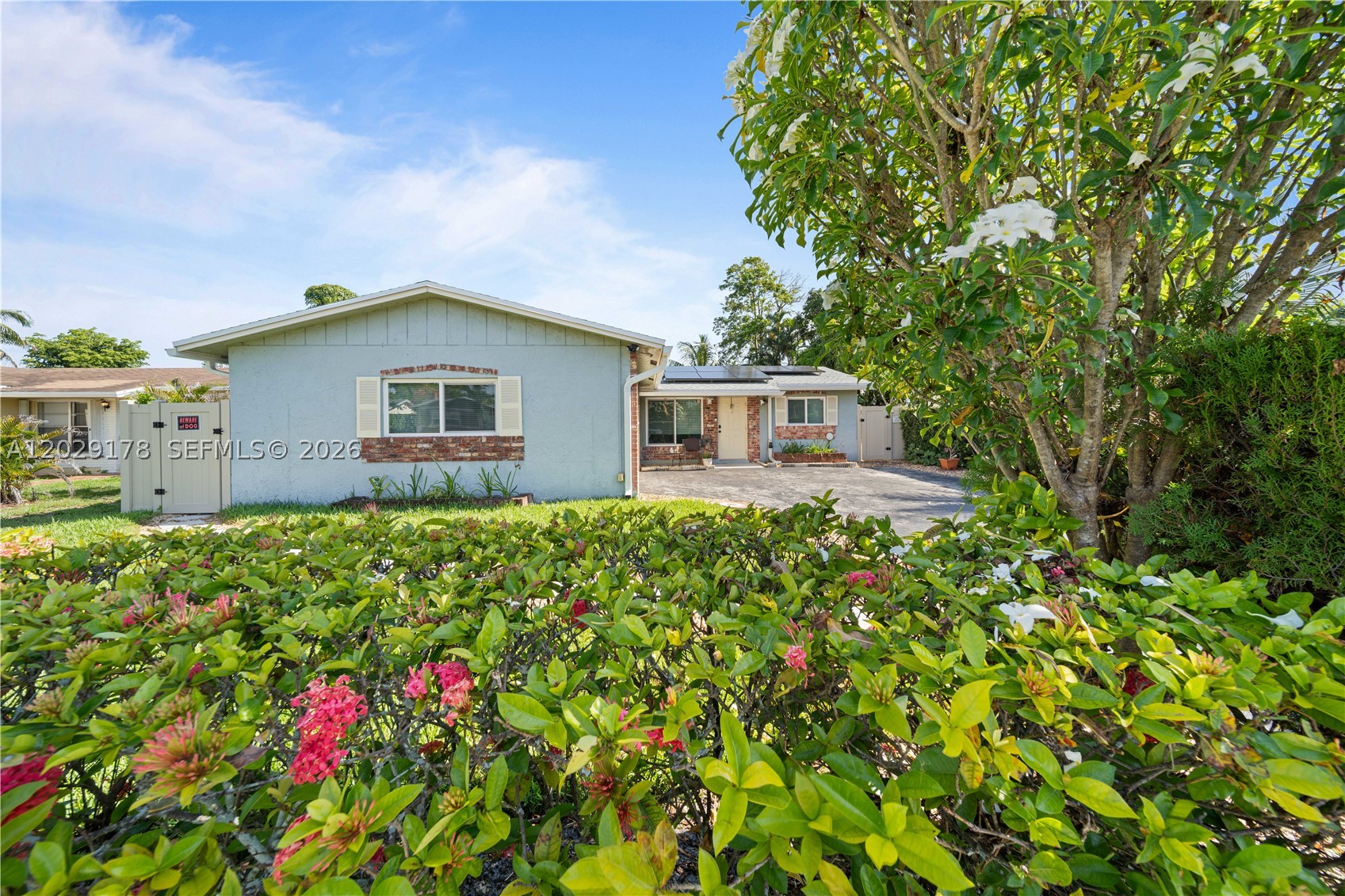 Here's your chance to enjoy FANTASTIC UPGRADES at a bargain price!  In the past couple of years the seller has upgraded as follows:  new ROOF, complete new A/C SYSTEM & DUCTS, new ELECTRIC PANEL, new POOL PUMP, and a complete SOLAR SYSTEM that powers the entire house (Imagine living with MINIMAL ELECTRIC BILLS ... less than $50 per month!).  There are IMPACT SAFE windows and doors throughout the house.  The spacious kitchen features sharp shaker cabinets.  (Seller will credit $2000 towards replacement of kitchen counter.) The master bath was renovated with a beautiful tile shower with river rock floor. Neutral ceramic tile throughout the home.   There's a large covered & screened patio plus open deck area overlooking the pool, fruit trees, and tranquil canal ... a great place to stop and listen to the birds and watch the sunrise and sunset.   Sprinkler system feeds from the canal.  Newer privacy fence on either side of yard.  Two car garage (now partially divided as an office but can easily be removed).  This home provided many happy years and is now ready for a new family to make more happy memories!