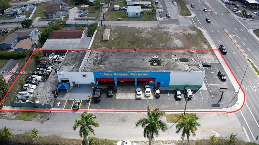 Rare high-exposure flex industrial/retail asset positioned on a signalized corner along NW 27th Ave, one of Miami-Dade’s busiest corridors with 75,000–100,000+ vehicles passing daily. This versatile property combines industrial functionality with a strong retail component, anchored by Cricket Wireless, providing immediate in-place income and tenant stability.

The 8,000 SF building sits on over 0.56 acres, offering a highly functional layout with grade-level doors, 20’ ceilings, and excess land ideal for outdoor storage, fleet use, or future expansion. The flexible configuration makes it ideal for automotive, contractor, logistics, or service-based owner-users seeking both operational efficiency and unmatched visibility.

Strategically located with immediate access to I-95 and the Florida Turnpike, and surrounded by dense residential population exceeding 500,000 within a 5-mile radius, the property benefits from strong consumer demand and consistent traffic flow.

This is a true value-add opportunity with below-market in-place income, allowing a new owner to increase rents, occupy the space, or reposition the asset to maximize returns. Opportunities to acquire a flex asset with land, exposure, and an established retail anchor tenant in this submarket are extremely limited.