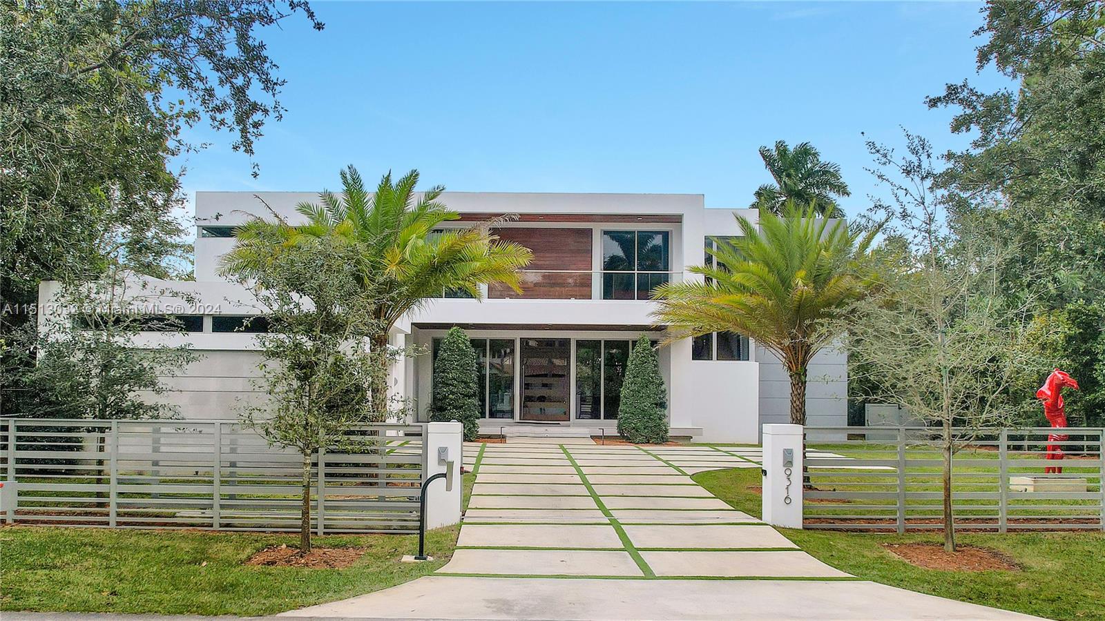 Prime North Pinecrest 7 beds / 7 baths home on a 16,003 sq ft lot! This exquisite high-end property, aprox 6,228 Sq.Ft (adjusted) is the epitome of luxury living in SoFlo. Built in 2022, this modern home features top-of-the-line finishes that radiate sophistication. Includes a state-of-the-art swimming pool, equipped with a powerful turbine for counter-current swimming, perfect for fitness enthusiasts or those seeking relaxation! Additionally, the residence includes a dual electric vehicle charging setup, marble floors, sub-zero/wolf appliances, RH chandeliers, advanced high-definition Lutron sound system provides an unparalleled auditory experience, projector with retractable cinema screen, custom cabinets, closets and much more. Near shopping and dining. **Red sculpture is not included.