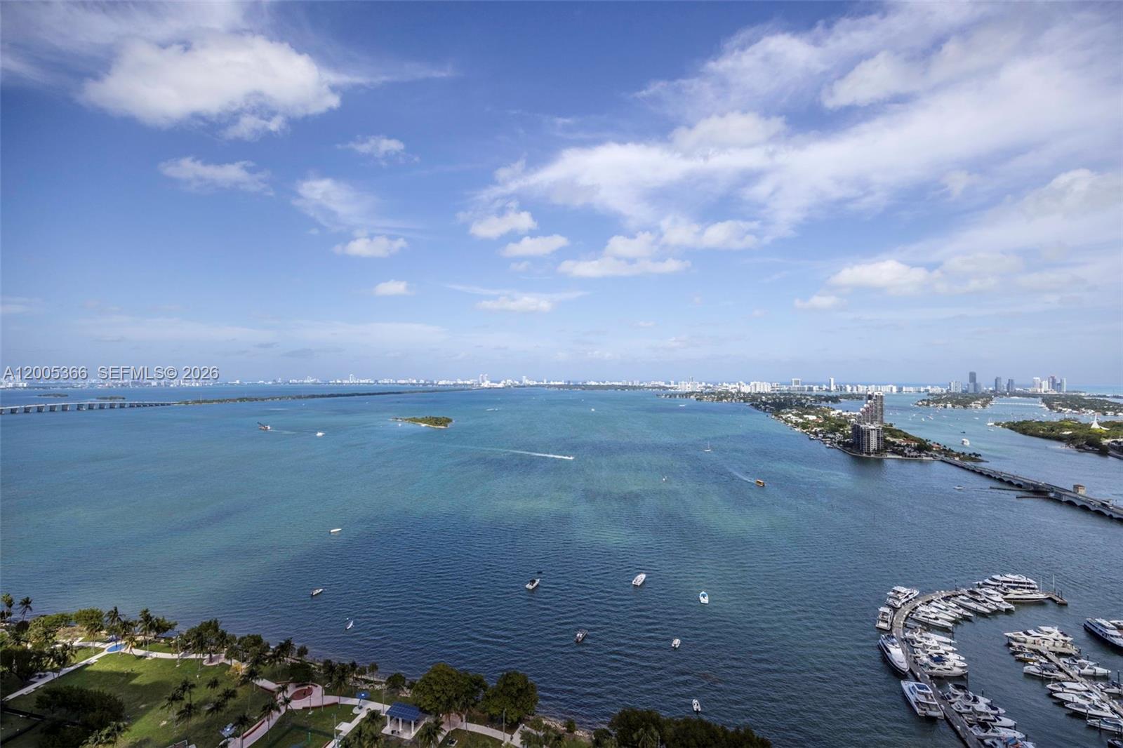 Perched in Opera Tower’s coveted “01 line,” this 38th-floor corner sky residence captures sweeping, unobstructed views of Biscayne Bay, the Atlantic Ocean, and the Miami Beach skyline. The 2-bedroom, 2-bath layout spans 1,048 SF and is wrapped in floor-to-ceiling impact glass, filling the interiors with natural light and opening to an expansive wraparound terrace designed for effortless indoor-outdoor living. The kitchen features granite countertops and stainless steel appliances, complemented by tile flooring throughout and in-unit laundry. Positioned across from Margaret Pace Park and near Sea Isle Marina, residents enjoy flexible 30-day rentals, allowing up to 12 leases per year. Opera Tower offers a full-service lifestyle with a renovated recreation deck, Olympic-size pool, whirlpools, fitness center, valet, 24/7 security, and convenient on-site retail including a gourmet market and dining.