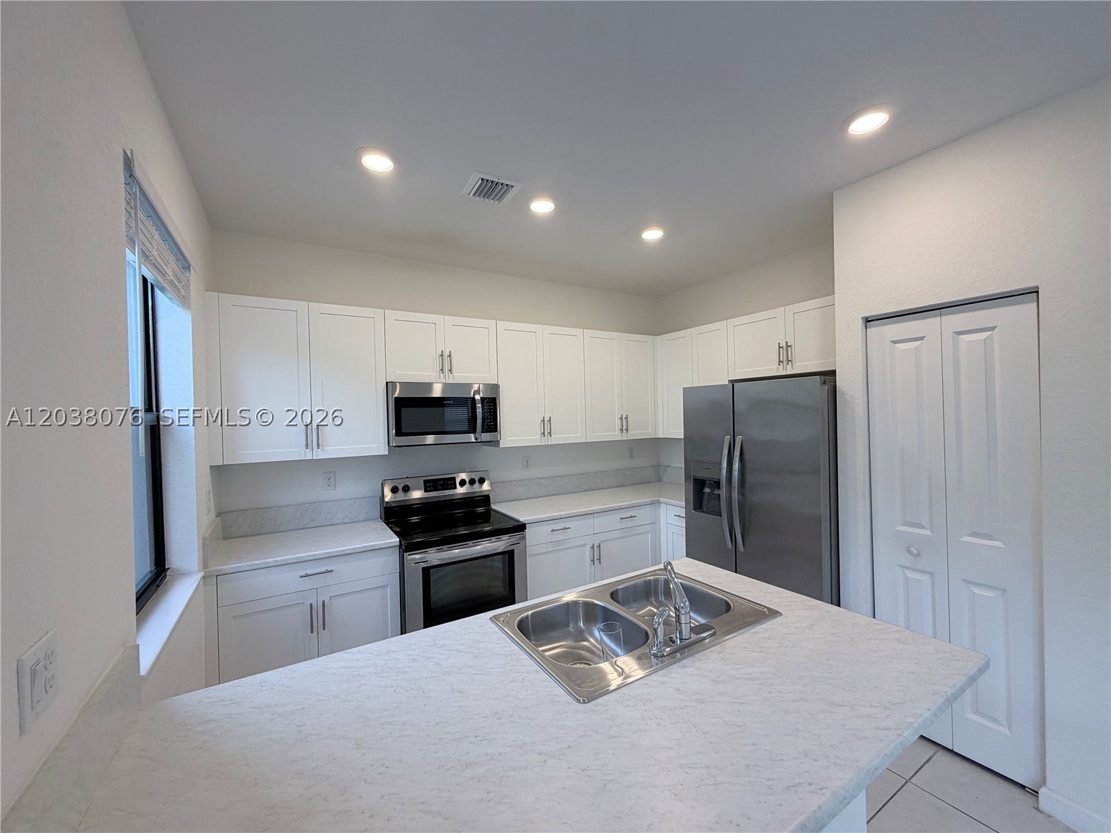 CORNER HOME 3 BEDS - 2-1/2 BATHS WITH NATURAL LIGHT AND CAR GARAGE FOR EXTRA SPACE. STAINLESS STEEL APPLIANCES IN AN OPEN KITCHEN WITH TITLE FLOORS IN FIRST FLOOR AND CARPET IN SECOND WITH WASHER AND DRYER. THE HOME HAS A COMPLETE FENCE PATIO. GREAT COMMUNITY PINE VISTA GREAT LOCATION NEAR TO TURNPIKE, SHOPPING CENTER, RESTAURANTS. 
DREAM INVESTOR PROPERTY IS RENTED $2,400 UNTIL APRIL 30 2027