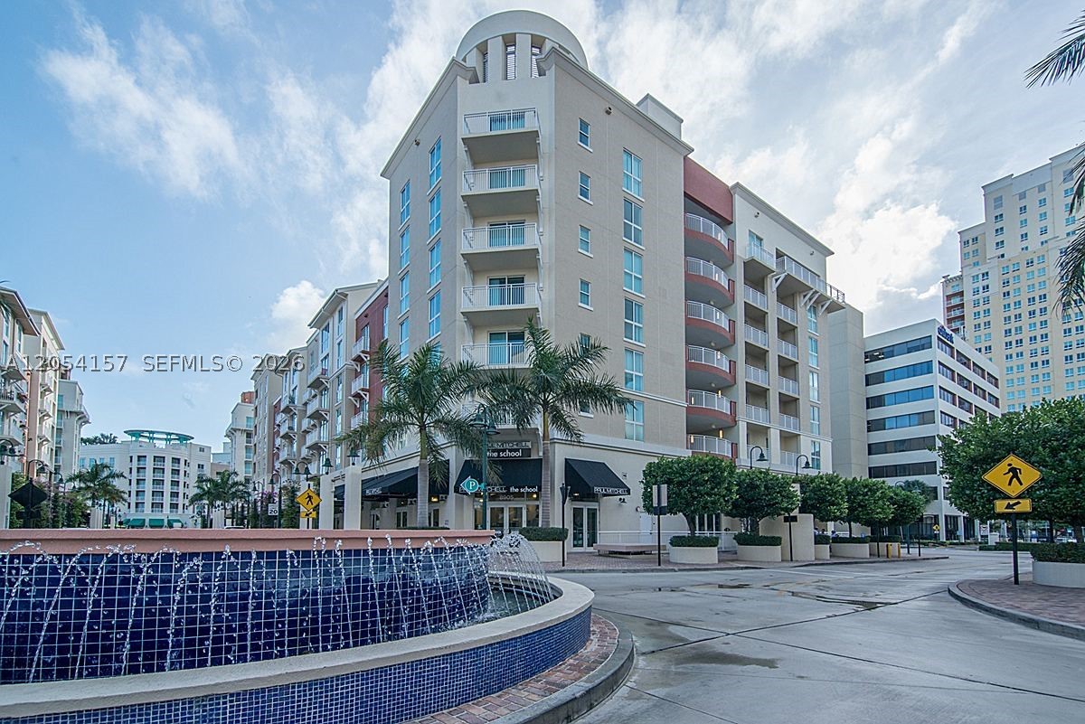 Experience elevated living in this exceptional top-floor corner residence—the highest floor in the building—in the highly sought-after Downtown Dadeland community. Bathed in natural light from its desirable corner exposure, the home showcases a clean, contemporary design palette and a spacious, thoughtfully designed floor plan. One assigned covered parking space is included for added convenience.  Residents enjoy an array of amenities, including a resort-style community pool, fully equipped fitness center, secure building access, and beautifully maintained common areas. Ideally located in one of Miami's most walkable neighborhoods, you'll be just steps from Dadeland Mall, premier shopping, dining, cafés, and everyday conveniences. Enjoy effortless connectivity with immediate access to Metrorail, the Palmetto Expressway, and US-1, while being just minutes from the University of Miami, South Miami Hospital, Baptist Hospital, and other major employment and healthcare centers. Offering the perfect blend of style, comfort, convenience, and location, this residence is an exceptional opportunity to experience the very best of South Miami living.