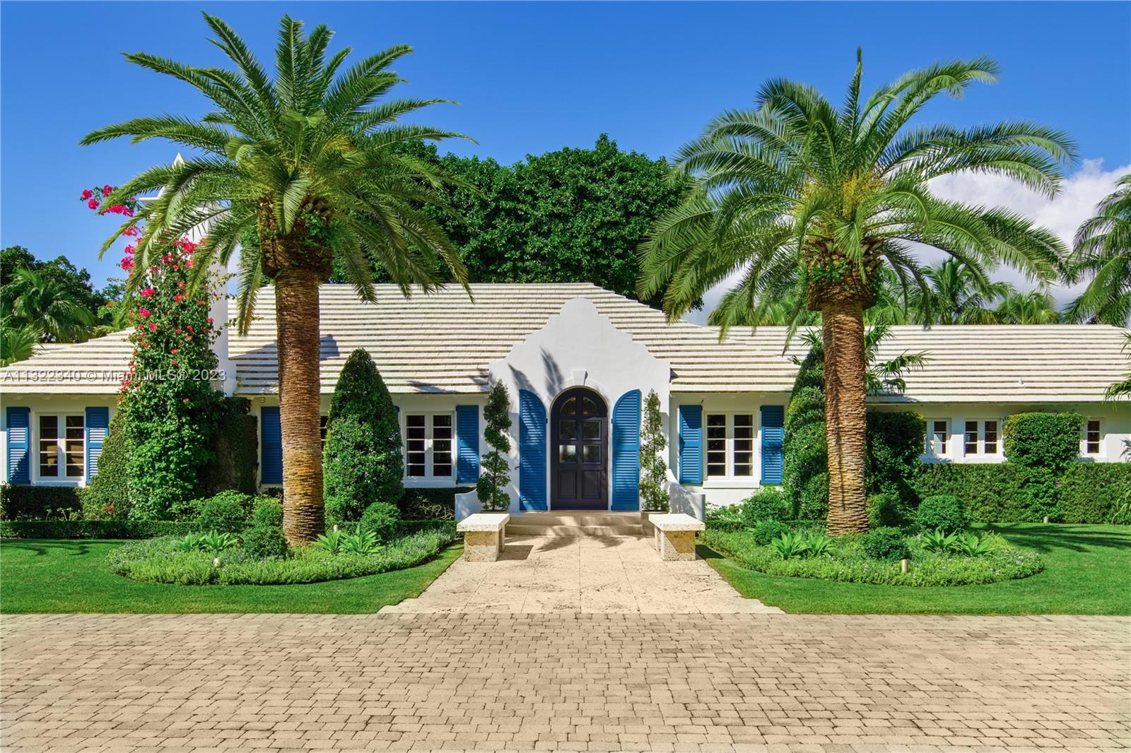 A home of old-world elegance situated on nearly an acre-and-half in the guard-gated community of Snapper Creek Lakes, offering residents their own sheltered dockage with a dock master and fuel dock, this property has been meticulously renovated to be an exquisite luxury residence. The lushly landscaped walled and gated property offers a stately main house with living spaces clustered around a large salt water pool surrounded by an elegant courtyard terrace. Copious loggias and lanais provide many areas for entertaining grandly underneath the shade of a towering banyan tree. Within the smart-system home, is a vast chef’s kitchen, gym, a 2-car garage, house generator, outdoor shower, 7 bedrooms, including a massive primary suite with his and hers dressing rooms, and an opulent primary bath.